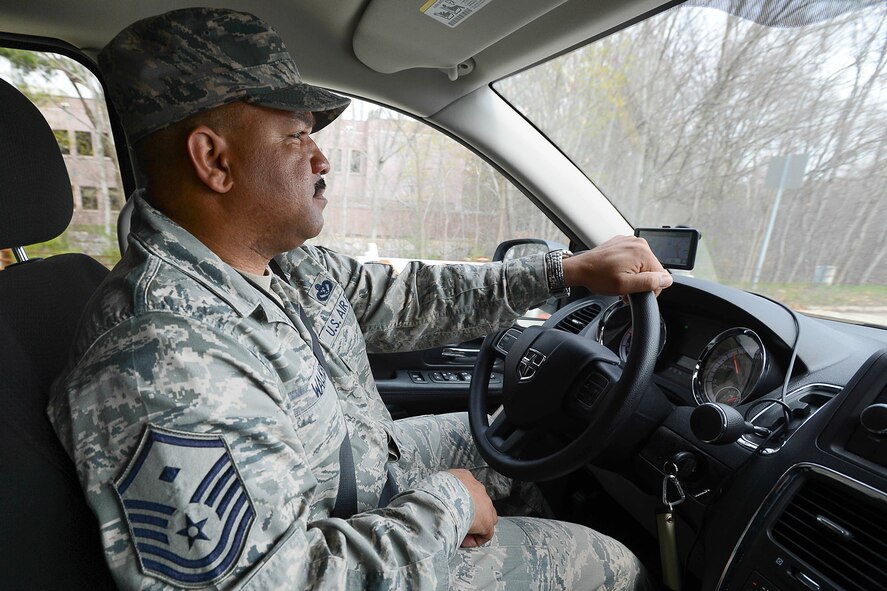 Master. Sgt.  Kevin Walker, 319th Recruiting Squadron first sergeant, drives to the Minuteman Senior Services office to volunteer with Meals-on-Wheels Community Project, April 30. Walker and others attending a First Sergeant Seminar on base paused to deliver meals to area senior citizens. (U.S. Air Force photo by Jerry Saslav)