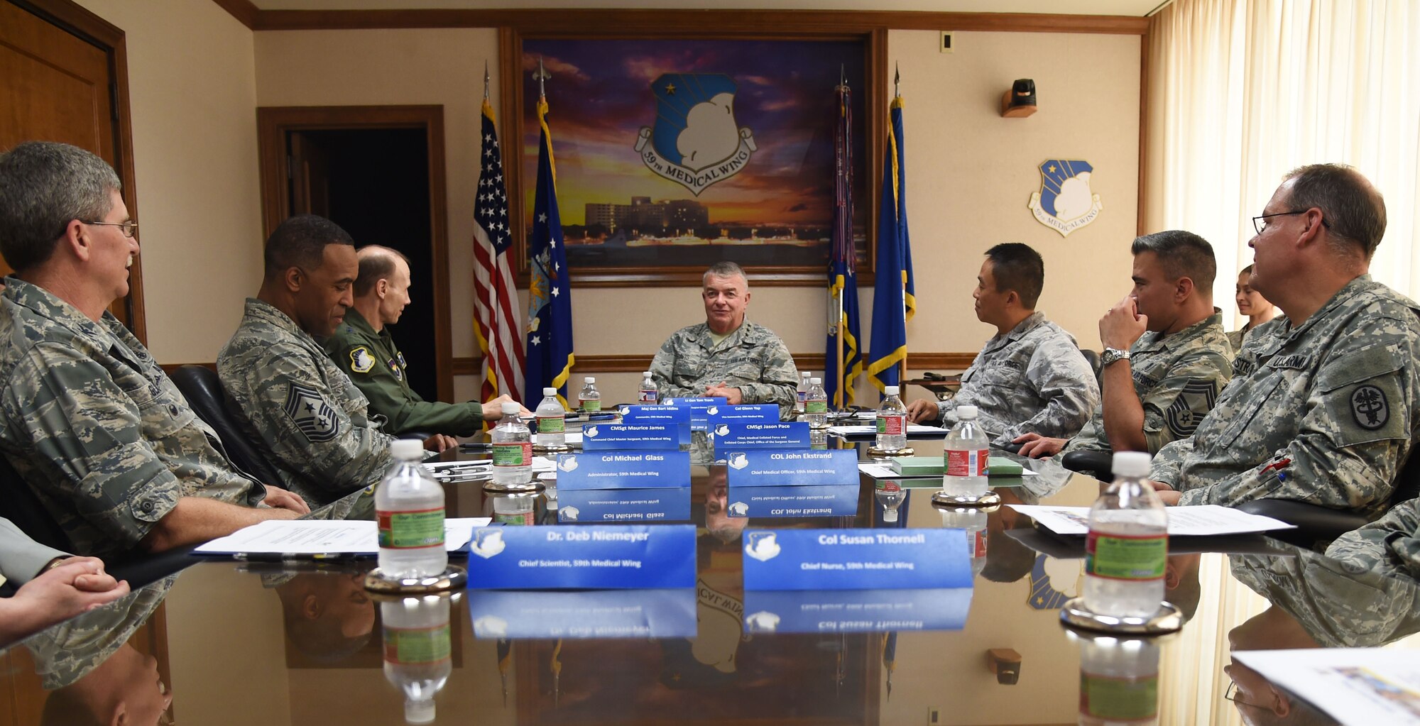 Air Force Surgeon General Lt. Gen. (Dr.) Thomas Travis meets with 59th Medical Wing senior leaders May 7, 2015 during a visit to the Wilford Hall Ambulatory Surgical Center, Joint Base San Antonio-Lackland, Texas. During his visit, Travis viewed Lean Daily Management boards, a process improvement tool used throughout the medical wing. (U.S. Air Force photo/Staff Sgt. Jerilyn Quintanilla)