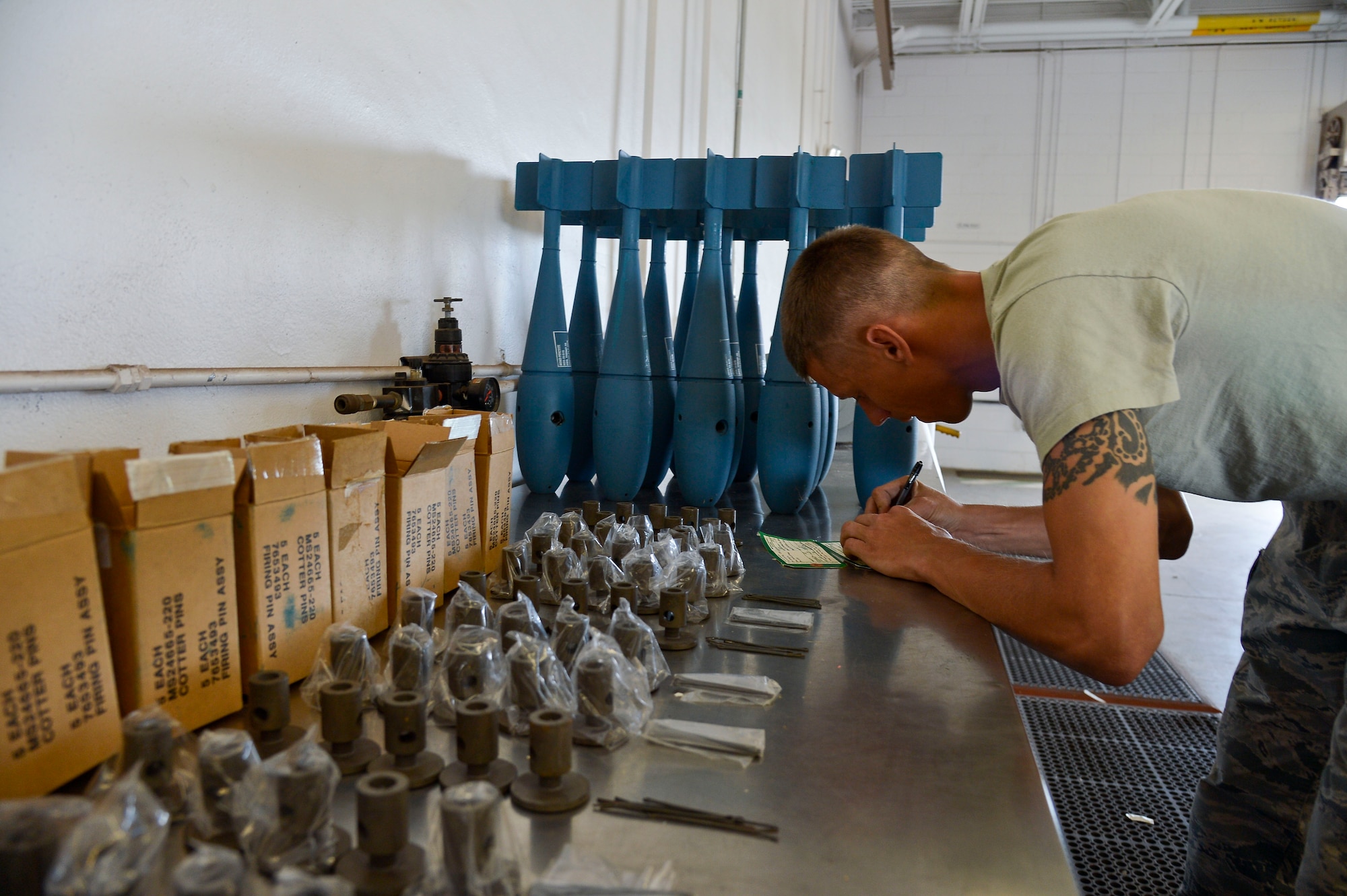 Staff Sgt. Justin Splain, 6th Maintenance Squadron senior munitions inspector, inspects and labels cotter pins at MacDill Air Force Base, Fla., April 23, 2015. Splain deals with all the documentation issues, turn-ins, and expenditures to ensure that the individuals are turning in the right assets. (U.S. Air Force photo by Senior Airman Shandresha Mitchell/Released)