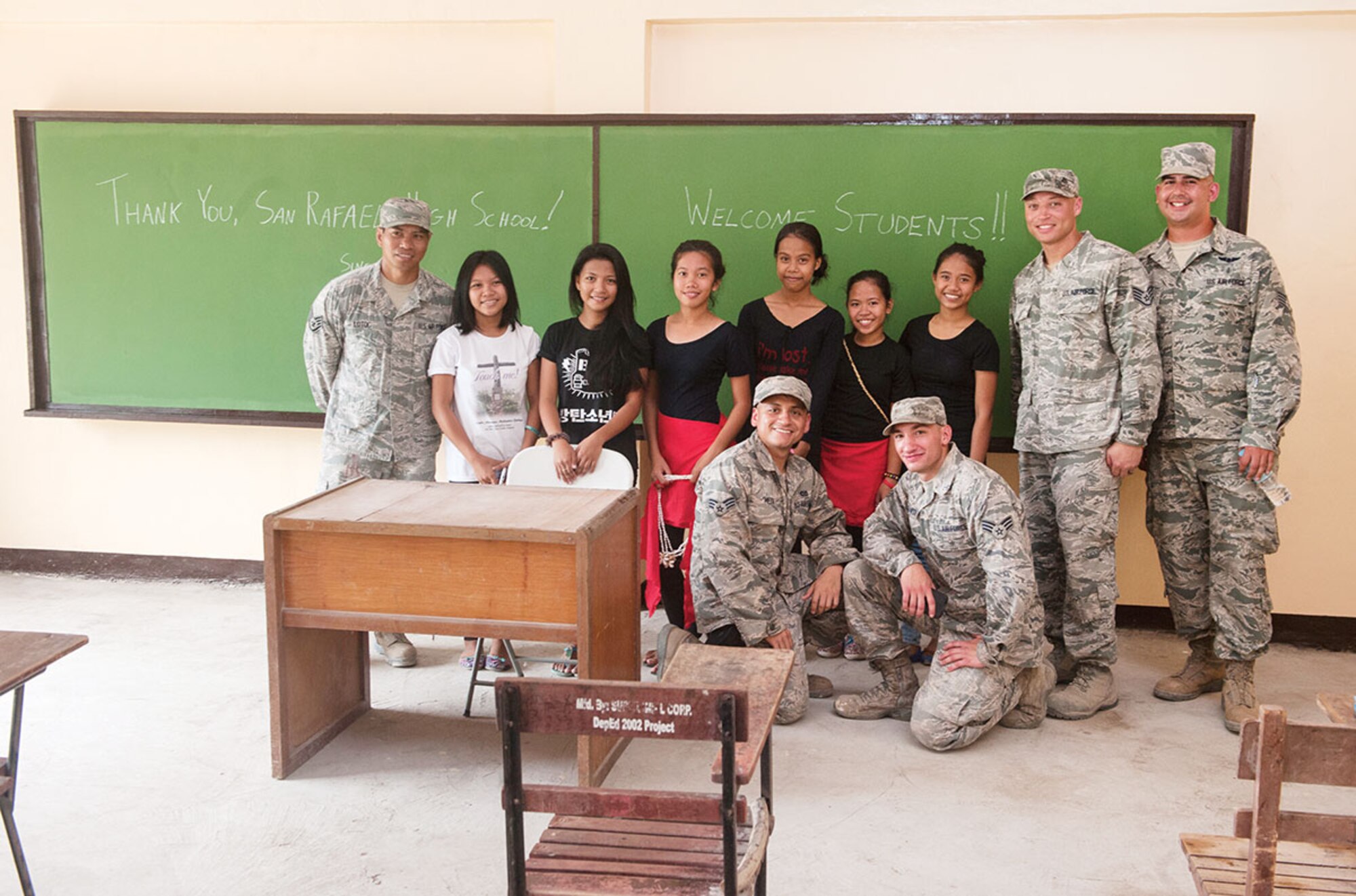 U.S. Air Force airmen, from the 673rd Civil Engineer Group, pose for a photo with residents of barangay San Rafael, in a newly built classroom during exercise Balikatan 2015’s San Rafael Elementary School ribbon cutting, in San Rafael, Palawan, Philippines, April 28. Construction of the BK15 humanitarian civic assistance projects started this past March with the Armed Forces of the Philippines, U.S. forces and Australian forces working shoulder-to-shoulder to construct a two-classroom building for Santa Lourdes National High School, Sabang Elementary School, San Rafael High School and San Rafael Elementary School. This year marks the 31st iteration of the exercise, which is an annual Philippine-U.S. bilateral military training exercise and humanitarian civic assistance engagement. (U.S. Air Force photo by Staff Sgt. Christopher Hubenthal/Released)