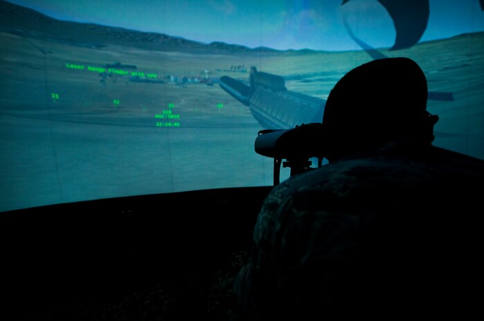 A tactical air control party Airman with the 14th Air Support Operations Squadron, Pope Field, N.C., surveys the landscape through a laser rangefinder inside the 6th Combat Training Squadron’s joint terminal attack controller virtual training facility at Nellis Air Force Base, Nev., April 29, 2015. Since 2013, the 6th CTS has graduated more than 500 TACP Airmen from their JTAC Qualification Course which provides them with the experience and expertise required to call for live fire. (U.S. Air Force photo by Senior Airman Joshua Kleinholz)