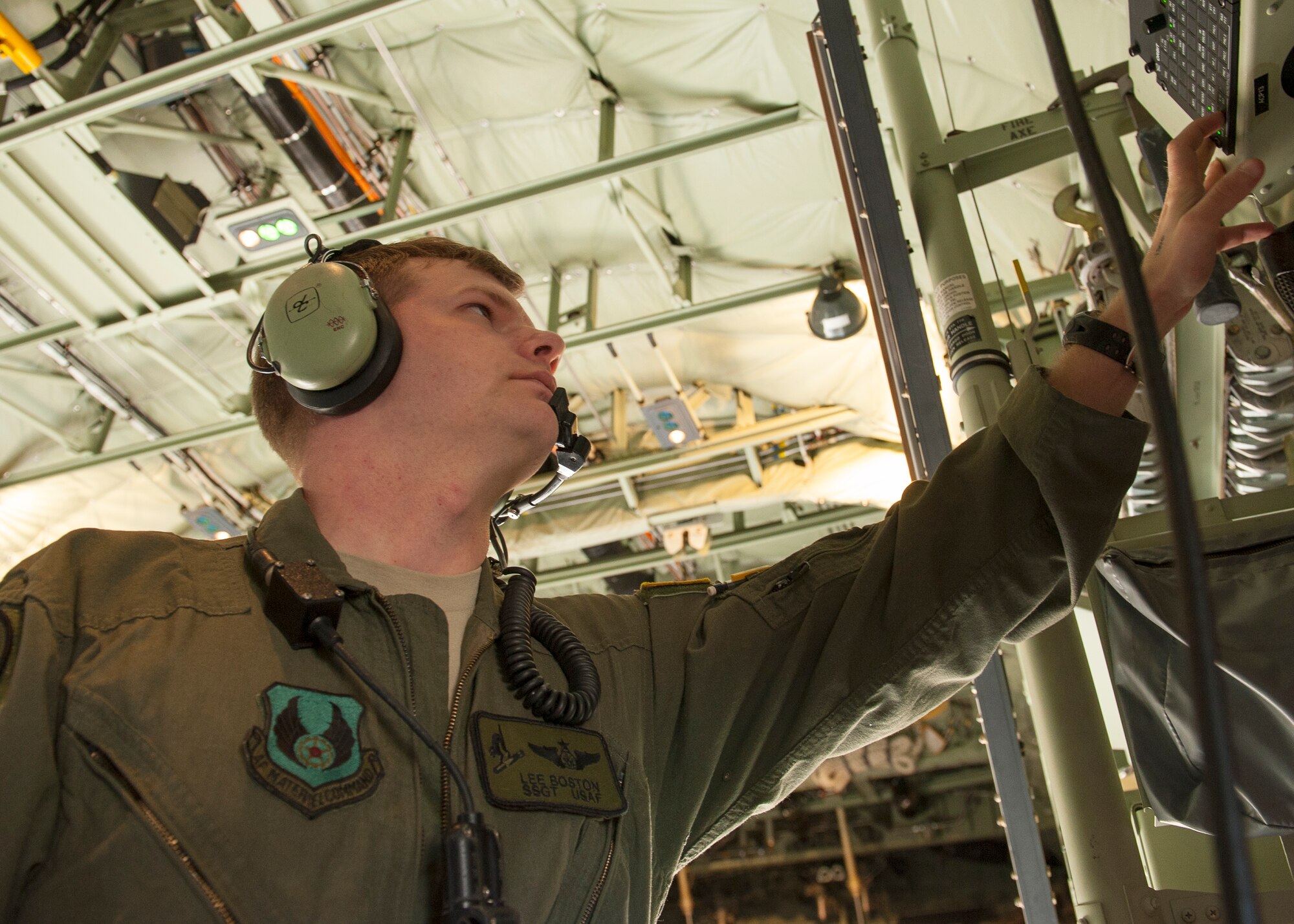 Staff Sgt. Lee Boston, a C-130 loadmaster with the 413th Flight Test Squadron, adjusts the audio control panel of an AC-130J during a pre-flight inspection near King Hangar at Eglin Air Force Base, Fla., March 27.  Flight crews operate the audio control panel to transmit communications and listen to radios or intercoms.  Crew communication is essential during test missions. The 413th  FLTS plans, executes and reports development tests and evaluations of all of the Air Force’s Special Operations Command’s aircraft as well as the Air Force’s vertical lift aircraft.  (U.S. Air Force photo/Ilka Cole) 