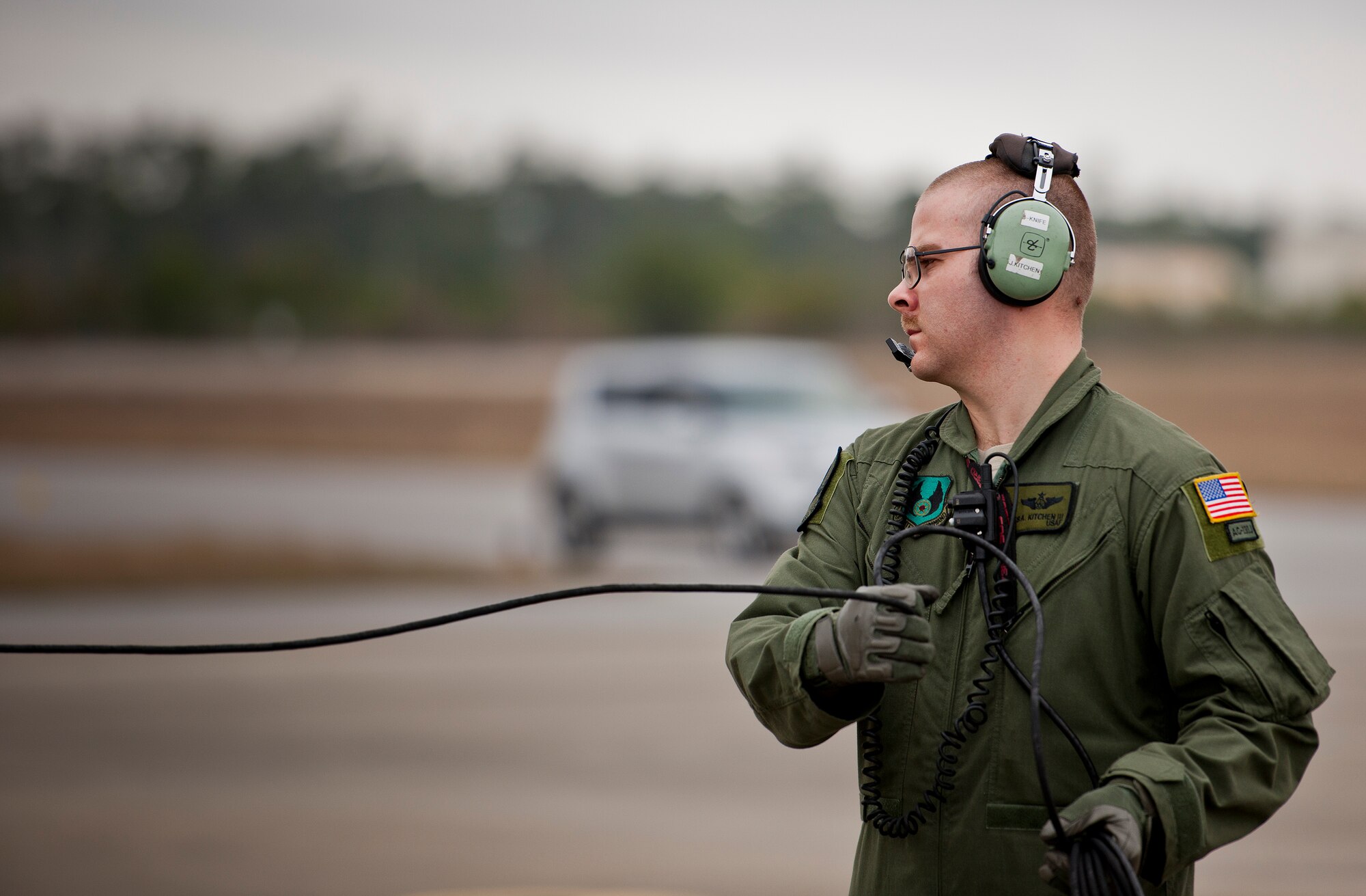 Tech. Sgt. James Kitchen, 413th Flight Test Squadron, communicates with the aircrew of an AC-130W prior to a test mission at Eglin Air Force Base, Fla.  The 413th has three flights that perform developmental and qualification testing on Air Force Special Operations Command and rotor aircraft to include C-130s, CV-22s and UH-1s.  The three flights are geographically separated at Hurlburt Field, Eglin and Duke Field.  (U.S. Air Force photo/Samuel King Jr.)