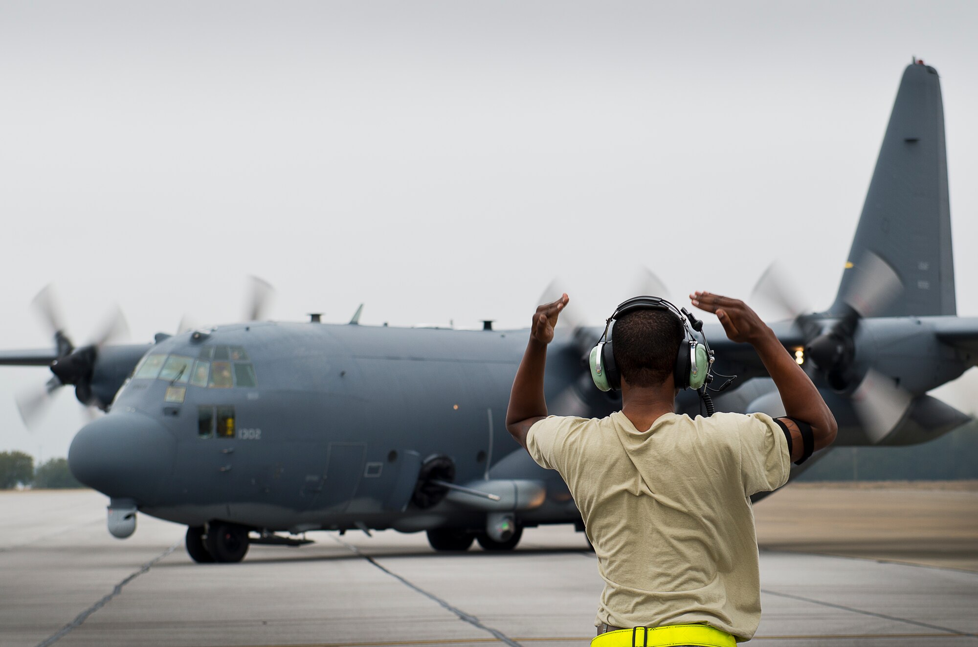 An Air Force Special Operations Command maintainer marshals out an AC-130W for a test mission at Eglin Air Force Base, Fla.  The testing was conducted by the 413th Flight Test Squadron.  The 413th has three flights that perform developmental and qualification testing on Air Force Special Operations Command and rotor aircraft to include C-130s, CV-22s and UH-1s.  The three flights are geographically separated at Hurlburt Field, Eglin and Duke Field.  (U.S. Air Force photo/Samuel King Jr.)