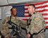 U.S. Air Force Maj. Ryan Bodge, 455th Expeditionary Security Forces Squadron commander, congratulates Tech. Sgt. Shawn Avery, 455th ESFS NCO in charge of police services, after revealing Avery’s selection for Officer Training School May 1, 2015 at Bagram Airfield, Afghanistan. After enlisting in 2001, Avery garnered recognition as an elite gate guard and Military Training Instructor, ultimately graduating from Park University with a degree in criminal justice and earning a candidacy at Officer Training School. (U.S. Air Force photo by Staff Sgt. Whitney Amstutz/Released)