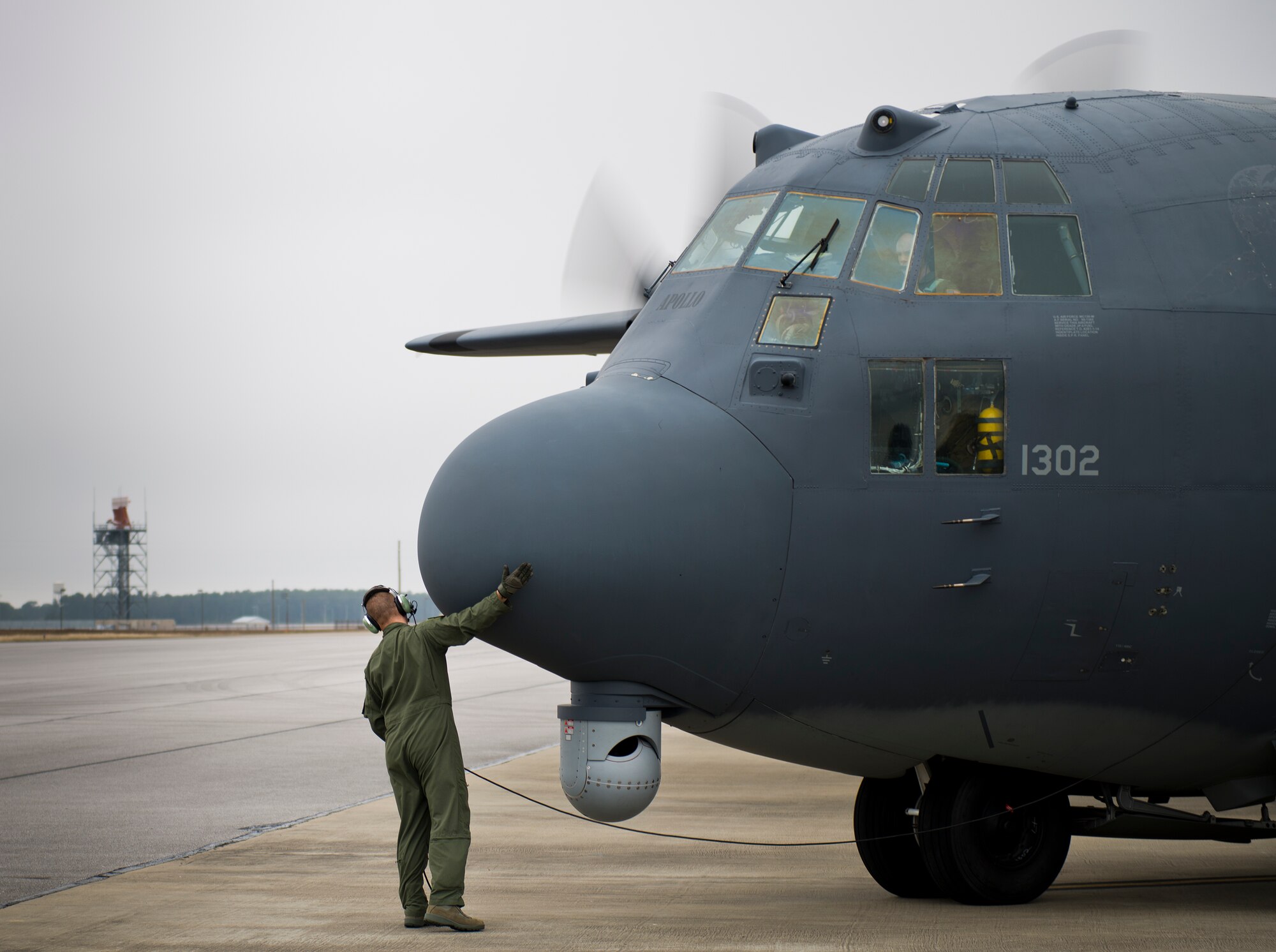 Tech. Sgt. James Kitchen, 413th Flight Test Squadron, touches the nose and completes a last check of the two left engines of an AC-130W prior to a test mission at Eglin Air Force Base, Fla.  The 413th has three flights that perform developmental and qualification testing on Air Force Special Operations Command and rotor aircraft to include C-130s, CV-22s and UH-1s.  The three flights are geographically separated at Hurlburt Field, Eglin and Duke Field.  (U.S. Air Force photo/Samuel King Jr.)