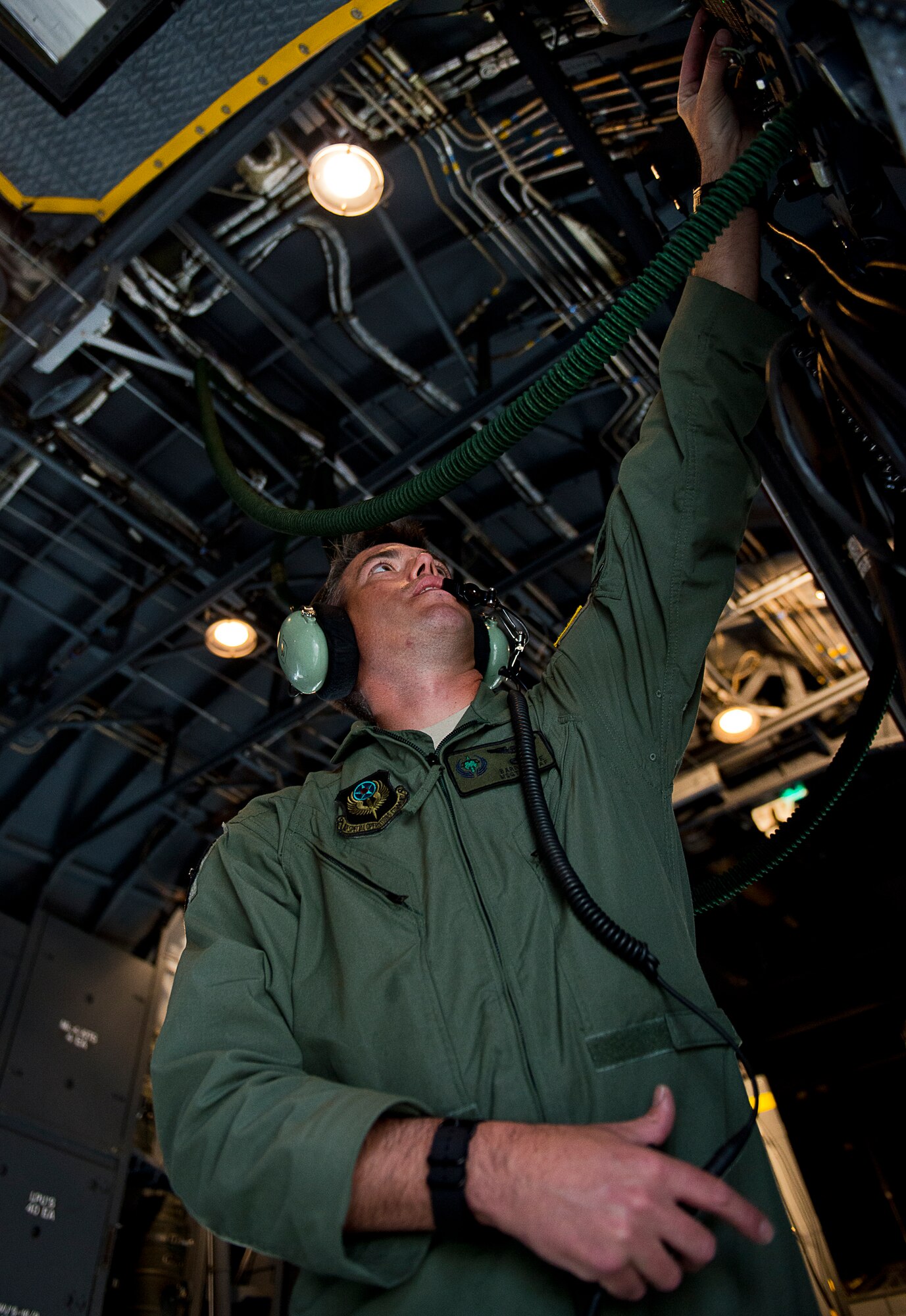A master sergeant with the Air Force Special Operations Command prepares his radio in the back of an AC-130W prior to a test mission at Eglin Air Force Base, Fla.  The 413th has three flights that perform developmental and qualification testing on Air Force Special Operations Command and rotor aircraft to include C-130s, CV-22s and UH-1s.  The three flights are geographically separated at Hurlburt Field, Eglin and Duke Field.  (U.S. Air Force photo/Samuel King Jr.)