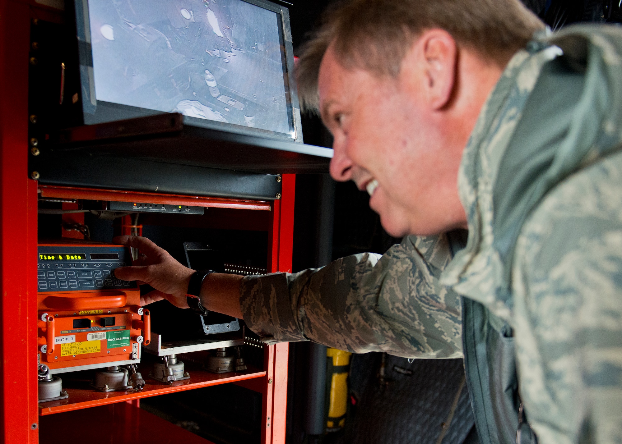 David Ulmer, 413th Flight Test Squadron, prepares the recording instrumentation mounted to the back of an AC-130W prior to a test mission at Eglin Air Force Base, Fla.  The 413th has three flights that perform developmental and qualification testing on Air Force Special Operations Command and rotor aircraft to include C-130s, CV-22s and UH-1s.  The three flights are geographically separated at Hurlburt Field, Eglin and Duke Field.  (U.S. Air Force photo/Samuel King Jr.)