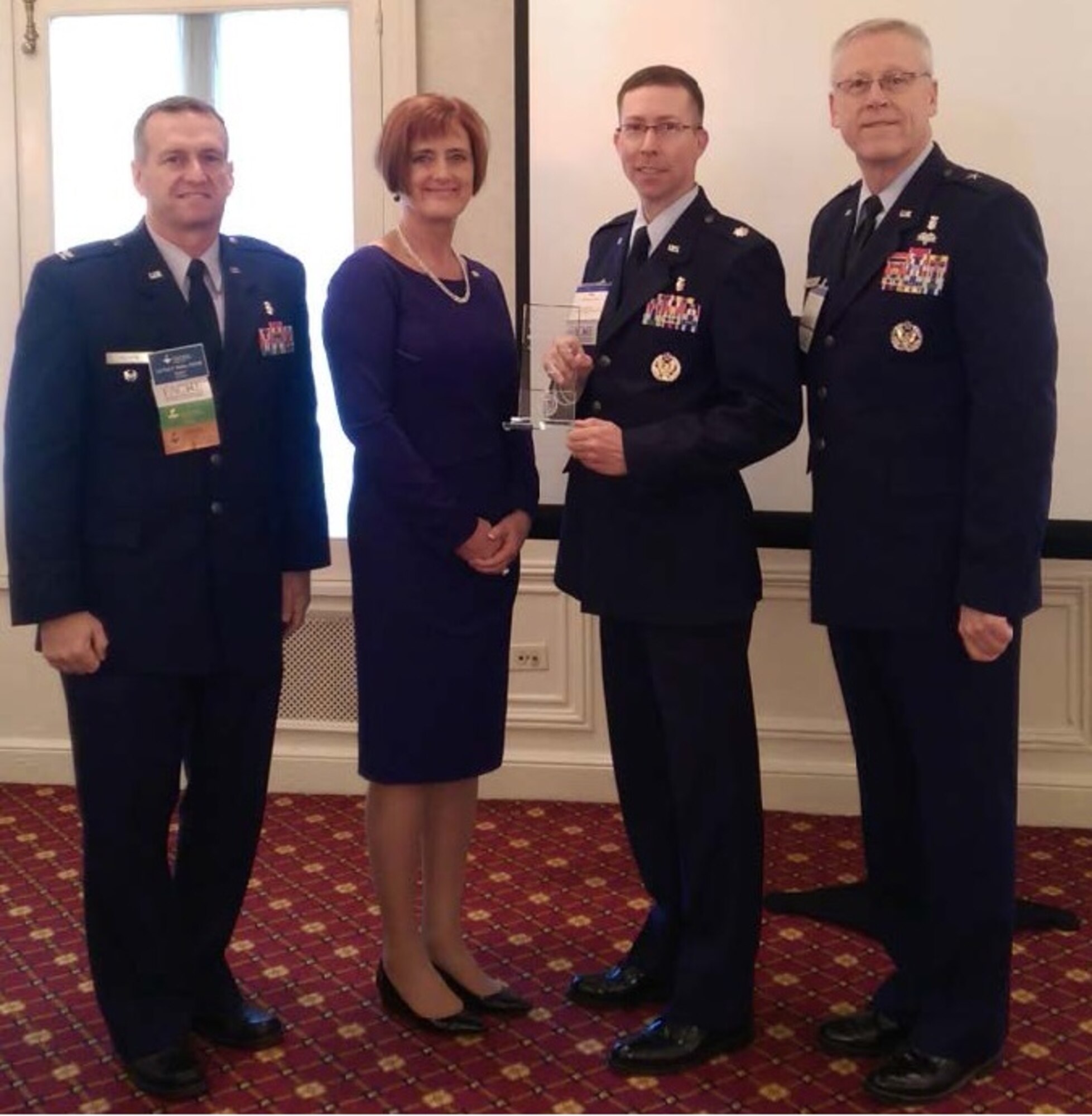 Lt. Col. Craig Keyes (second from the right) was presented the Senior-Level Healthcare Executive Regent’s Award by members of the American College of Healthcare Executives on March 17, 2015. The Senior-Level Healthcare Executive Regent's Award recognizes the best Air Force lieutenant colonel, senior master sergeant or chief master sergeant, who is board certified by the American College of Healthcare Executives (ACHE) and is currently or has previously served in positions with executive-level responsibilities. (Courtesy Photo)
