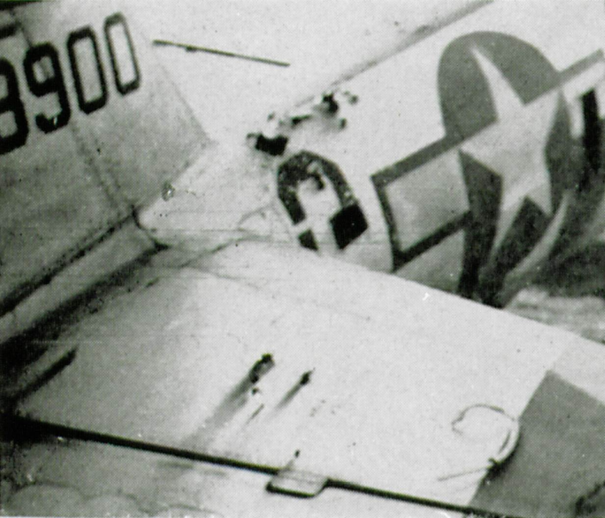 A 405th Fighter Squadron Thunderbolt, probably P-47D-28-RA serial number 42-28900, shows some battle damage from flak.  Although the holes atop the fuselage and horizontal stabilizer appear small, bullets or fragments of exploding shells could easily cause critical harm to the pilot or components inside the aircraft.  Repair of battle-damaged aircraft was an ongoing activity during the war in addition to the usual required maintenance.  (The Story of the 371st Fighter Group in the E.T.O.) 