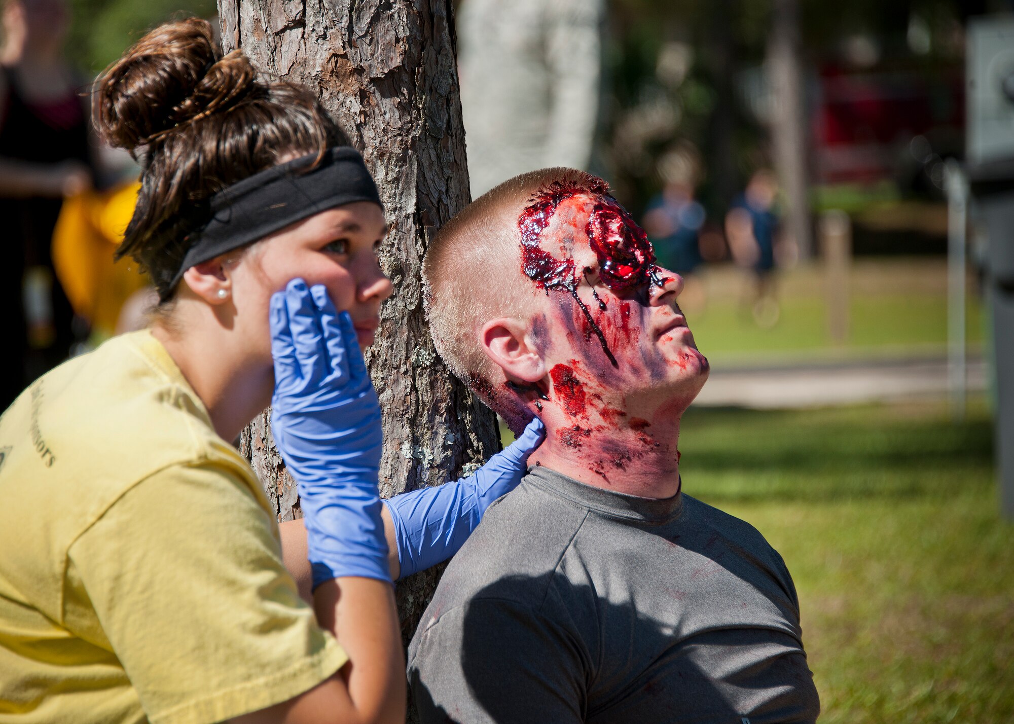 An Airman holds a simulated aircraft crash victim’s neck in place during a major accident response exercise in Valparaiso, Fla., May 5.  This large-scale joint exercise tested the response times and actions of base and local fire, emergency services and police personnel to an aircraft crash in local area waters.  Police, fire and medical technicians from Eglin, Valparaiso and Niceville participated in the exercise.  (U.S. Air Force photo/Samuel King Jr.)