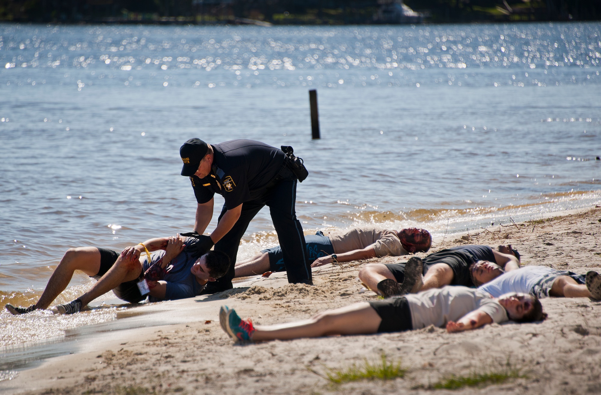 Carl Bomham, a Valparaiso Police investigator, pulls a victim of a simulated aircraft crash out of the water during a major accident response exercise in Valparaiso, Fla., May 5.  This large-scale joint exercise tested the response times and actions of base and local fire, emergency services and police personnel to an aircraft crash in local area waters.  Police, fire and medical technicians from Eglin, Valparaiso and Niceville participated in the exercise.  (U.S. Air Force photo/Samuel King Jr.)