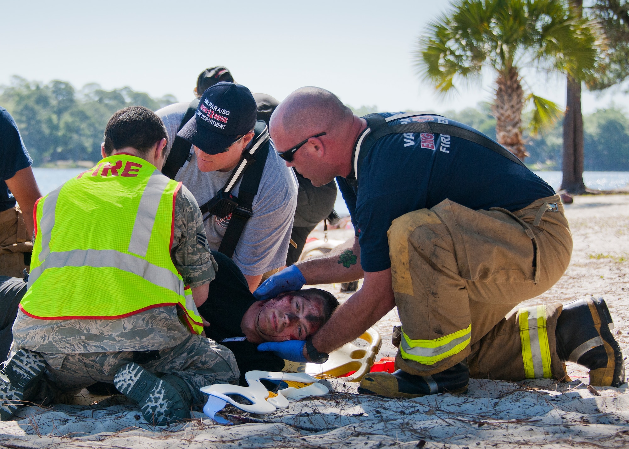 Emergency services personnel prepare to move a simulated aircraft crash victim during a major accident response exercise in Valparaiso, Fla., May 5.  This large-scale joint exercise tested the response times and actions of base and local fire, emergency services and police personnel to an aircraft crash in local area waters.  Police, fire and medical technicians from Eglin, Valparaiso and Niceville participated in the exercise.  (U.S. Air Force photo/Samuel King Jr.) 