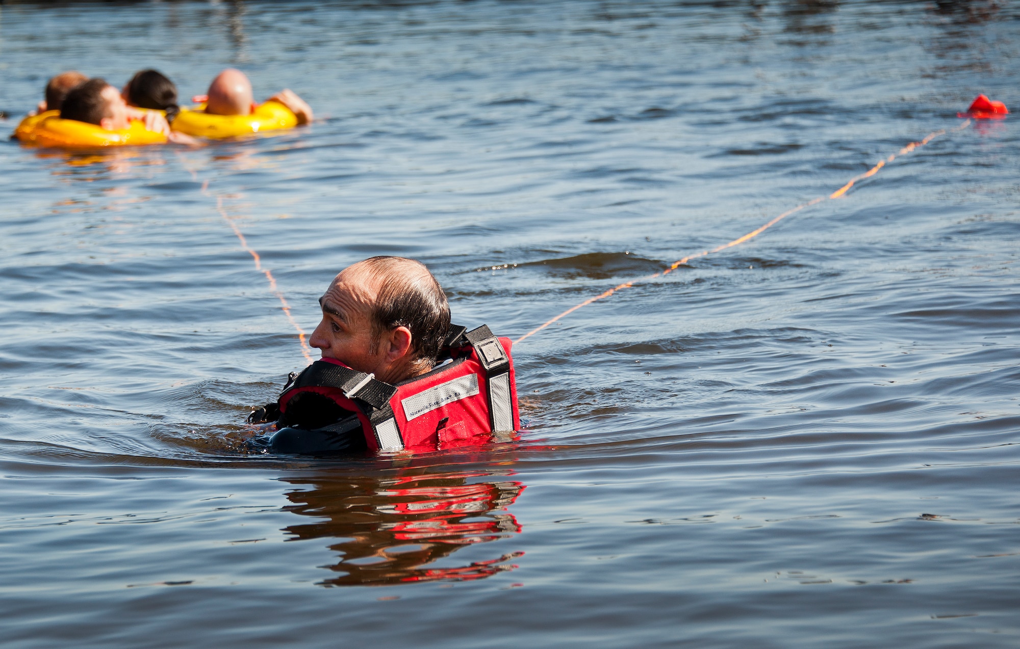 A Valparaiso Fire Department member pulls victims of a simulated aircraft crash out of the water during a major accident response exercise in Valparaiso, Fla., May 5.  This large-scale joint exercise tested the response times and actions of base and local fire, emergency services and police personnel to an aircraft crash in local area waters.  Police, fire and medical technicians from Eglin, Valparaiso and Niceville participated in the exercise.  (U.S. Air Force photo/Samuel King Jr.)