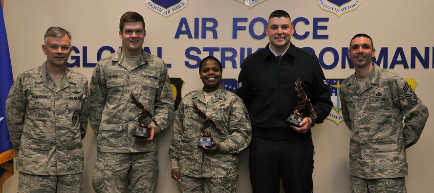 Outstanding Airman of the Year award recipients from the 509th Bomb Wing pose with Brig. Gen. Glen D. VanHerck, 509th Bomb Wing commander (left), and Chief Master Sgt. Shawn Drinkard, 509th BW command chief (right) at Barksdale Air Force Base, La., April 16, 2015. The wing’s winners were Senior Airman Mason Meherg, 509th Comptroller Squadron, Tech. Sgt. Shonta Simes, 509th Force Support Squadron and Senior Airman Ryan McGarrigle, 509th Operations Support Squadron. (U.S. Air Force photo/ Senior Airman Joseph Raatz)