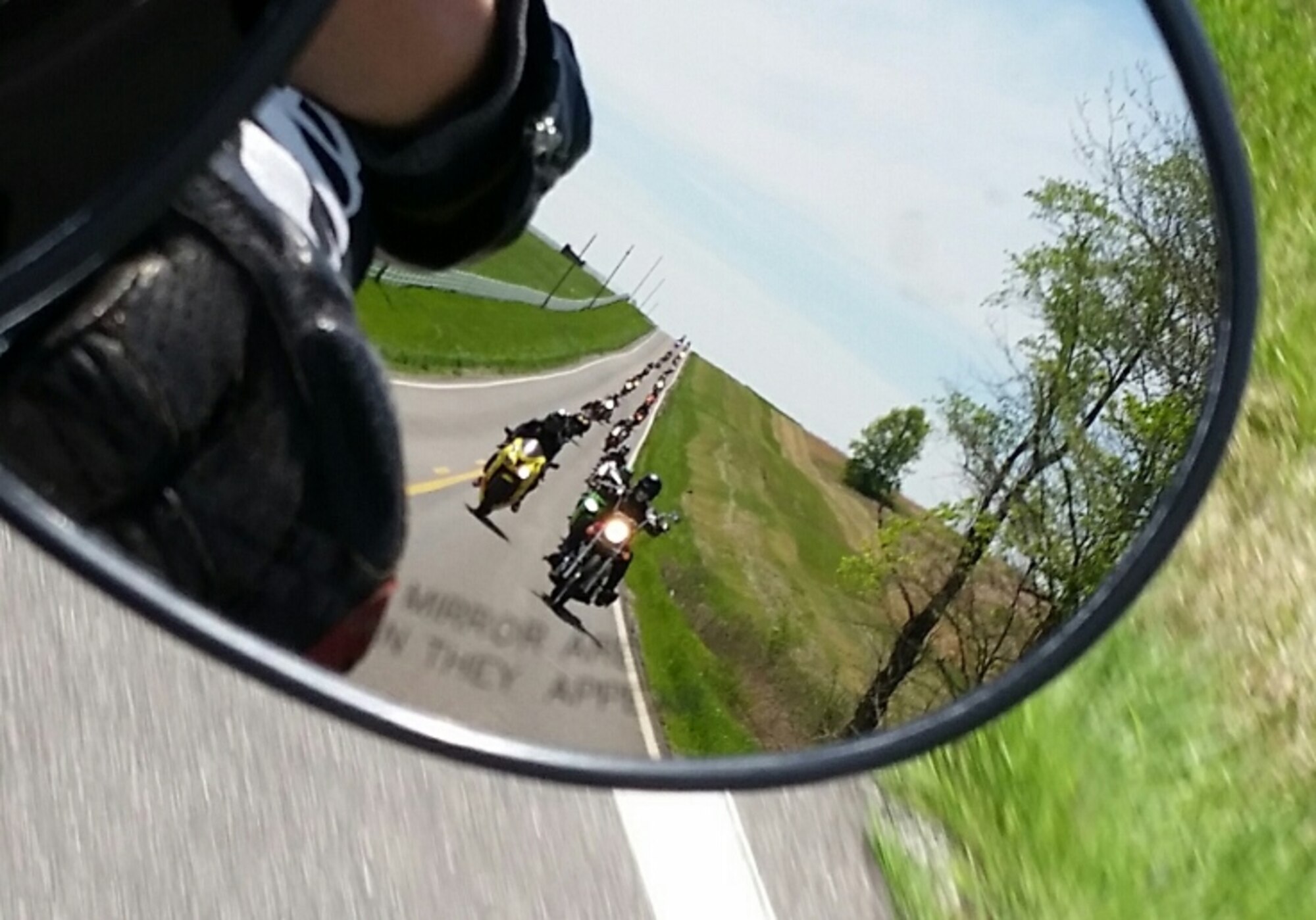 More than 35 riders participated in a mentorship ride to the Missouri Veterans Cemetery in Higginsville, Mo., April 27, 2015. Motorcyclists are required to have the proper protective equipment including gloves, helmet, eye protection, long sleeves and long pants. (U.S. Air Force photo by Staff Sgt. Alexandra M. Longfellow/Released)