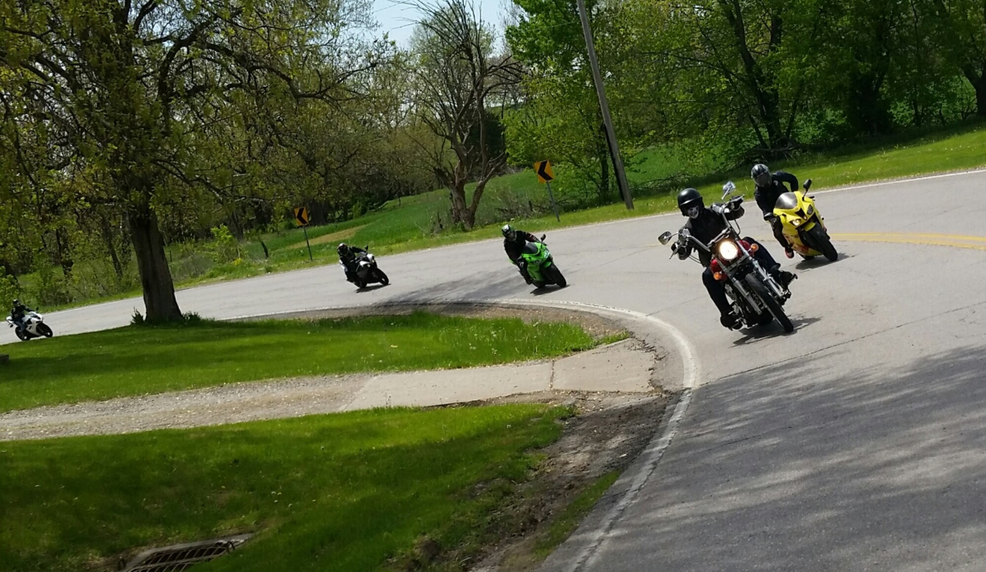 Motorcyclists ride to the Missouri Veterans Cemetery in Higginsville, Mo., April 27, 2015 as part of Motorcycle Safety Day. The individuals who participated in the mentorship ride cleaned headstones of dirt and debris. (U.S. Air Force photo by Staff Sgt. Alexandra M. Longfellow/Released)