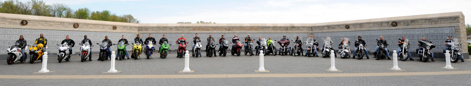 More than 35 riders participated in a mentorship ride to the Missouri Veterans Cemetery in Higginsville, Mo., April 27, 2015. The riders cleaned all headstones of dirt and debris as part of Motorcycle Safety Day. (U.S. Air Force photo by Staff Sgt. Alexandra M. Longfellow/Released)