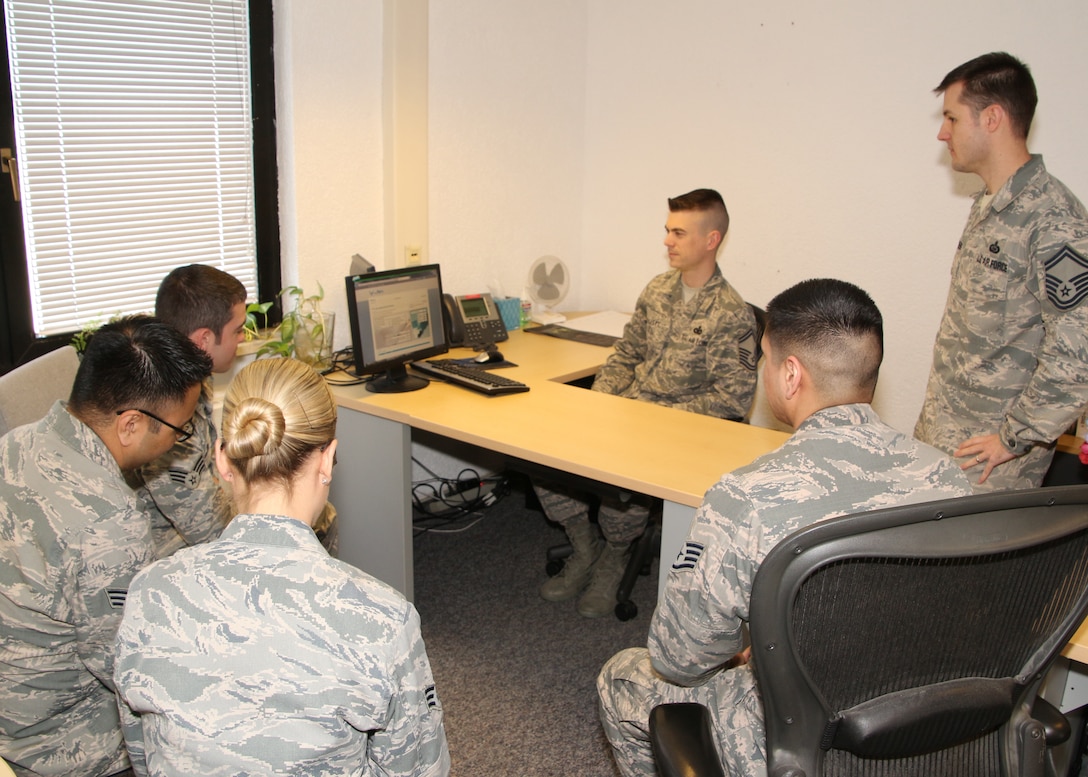 Senior Master Sgt. Nicholas Kollett, Enlisted Force Development Manager, Joint Force Headquarters, Massachusetts Air National Guard, Hanscom, Air Force Base, Mass., trains active-duty members on the Virtual Personnel Center (vPC) program, Ramstein Air Force Base, Germany, May 7, 2015. The active duty is currently using the Evaluation Management System (EMS) that is being phased out, requiring them to transition to vPC by September of this year. (U.S Air Force photo by Master Sgt. Kevin Martin/Released)