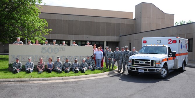 Members from the 509th Medical Group pose for a group photo for Nurse Appreciation Week at Whiteman Air Force Base, Mo., May 05, 2015. Nurses and medical technicians work behind the scenes ordering renewing medicine, reading communicating test results and relaying providing health information and education to patients. Doctors, nurses and medical technicians work together to ensure patient health improves. For most, inspiration to take care of people stems from prior experience and history. (U.S. Air Force Base photo by Senior Airman Keenan Berry/Released)