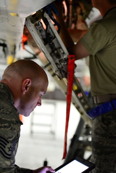 Tech. Sgt. Shelby Griscom, a Quality Assurance inspector at the 51st Maintenance Squadron Phase Docks goes over carded items with a Crew Chief working on an F-16 Fight jet at Osan Air Base, Republic of Korea, 28 April 2015. Crew Chiefs work around the clock at depaneling and inspecting all standard carded items such as the wings, landing gear and fuselage as well as performing preventive maintenance on the jet as a whole.  
(USAF photo by Staff Sgt. Amber Grimm)