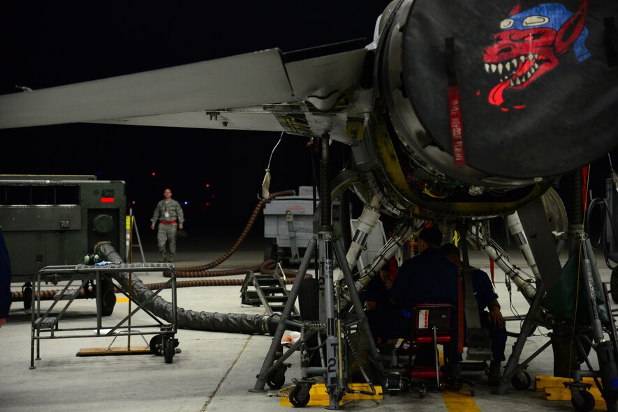 Midnight at the 51st Maintenance Squadron Phase docks sees the Crew Chiefs on shift working diligently on a newly arrived F-16 Fighter Jet at Osan Air Base, Republic of Korea, 28 April 2015. Crew Chiefs work around the clock at depaneling and inspecting all standard carded items such as the wings, landing gear and fuselage as well as performing preventive maintenance on the jet as a whole.  
(USAF photo by Staff Sgt. Amber Grimm)