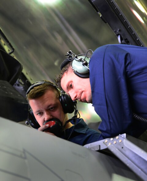Airman 1st Class Cody Duplaga and Staff Sgt. Matthew Nauta, Crew Chiefs assigned to the51st Maintenance Squadron Phase Docks run through a series of checks in the cockpit of an F-16 fight jet at Osan Air Base, Republic of Korea, 16 April 2015. Crew Chiefs work around the clock at depaneling and inspecting all standard carded items such as the wings, landing gear and fuselage as well as performing preventive maintenance on the jet as a whole.  
(USAF photo by Staff Sgt. Amber Grimm)
