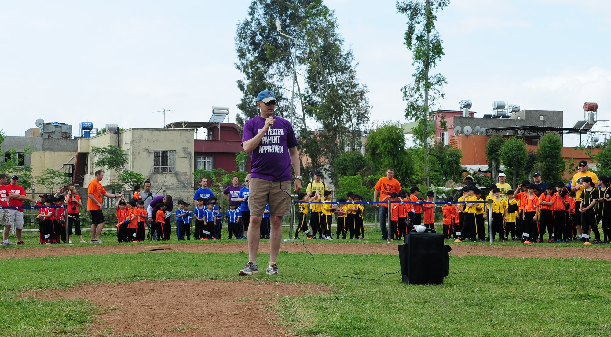 Col. Craig Wills, 39th Air Base Wing commander, gives opening remarks during the Incirlik Youth Sports baseball opening ceremony May 2, 2015, at Incirlik Air Base, Turkey. Various age groups from across base came together to start the 2015 youth baseball season. (U.S. Air Force photo by Staff Sgt. Caleb Pierce/Released) 