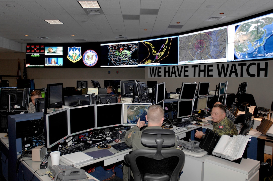 Members of U.S. Northern Command and the North American Aerospace Defense Command monitor systems and networks in the NORAD and Northcom Command Center on Peterson Air Force Base in Colorado Springs, Colorado, April 29, 2014. Courtesy photo by Mike Kucharek