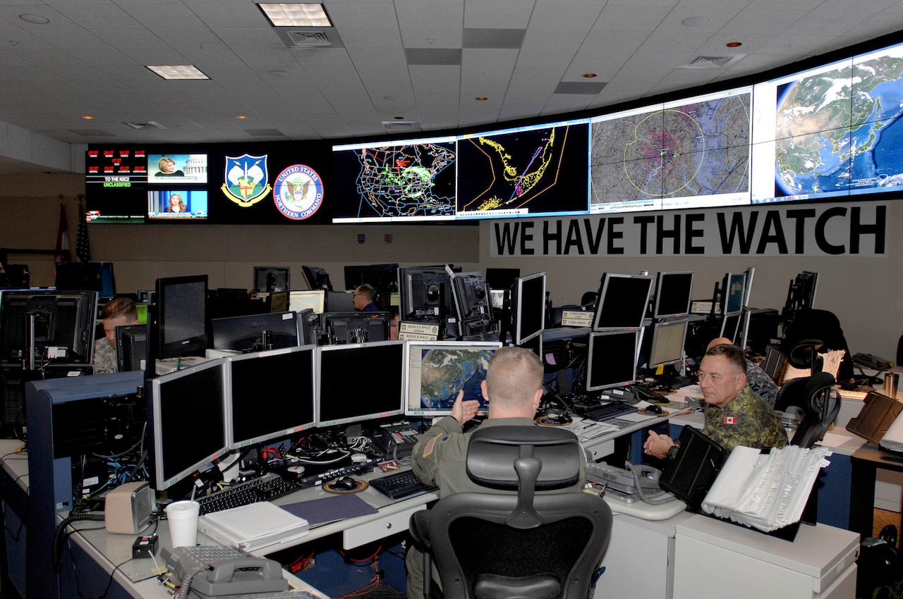 Members of U.S. Northern Command and the North American Aerospace Defense Command monitor systems and networks in the NORAD and Northcom Command Center on Peterson Air Force Base in Colorado Springs, Colorado, April 29, 2014. Courtesy photo by Mike Kucharek