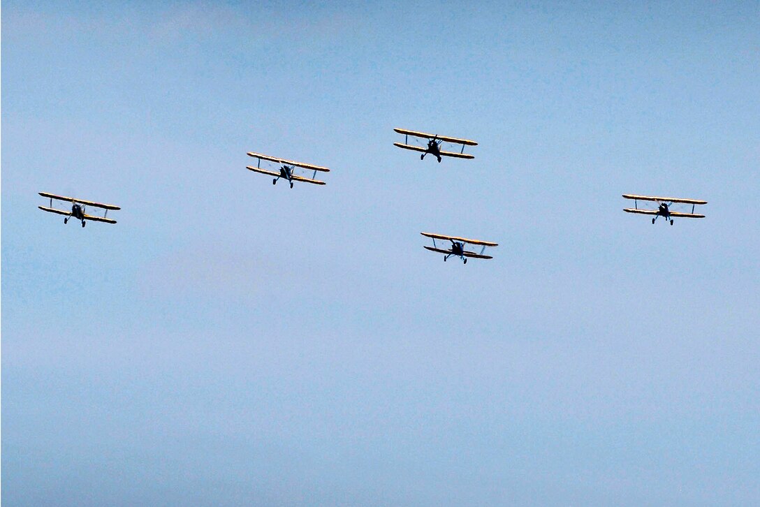 World War II aircraft fly over the nation's capitol as numerous vintage aircraft participate in the Arsenal of Democracy event to commemorate the 70th anniversary of Victory in Europe Day in Washington, D.C., May 8, 2015. More than two dozen aircraft flew in the event, which followed an air path along the Potomac River and passed over landmarks, including the Lincoln Memorial and Washington Monument. 
