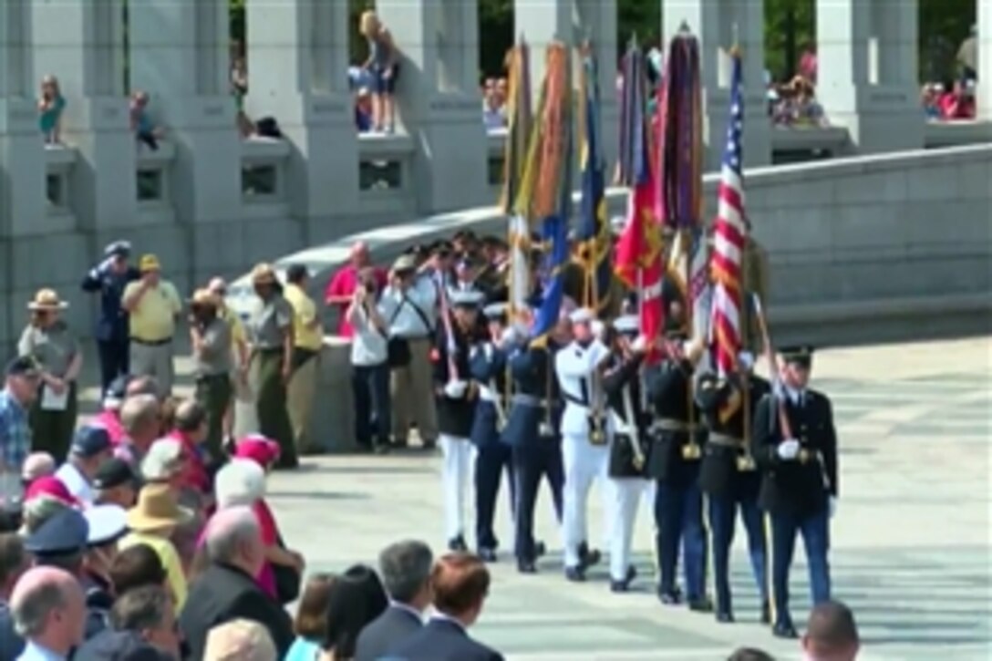 A joint color guard launches the ceremony to mark the 70th anniversary of Victory in Europe Day at the National World War II Memorial on the National Mall in Washington, D.C., May 8.