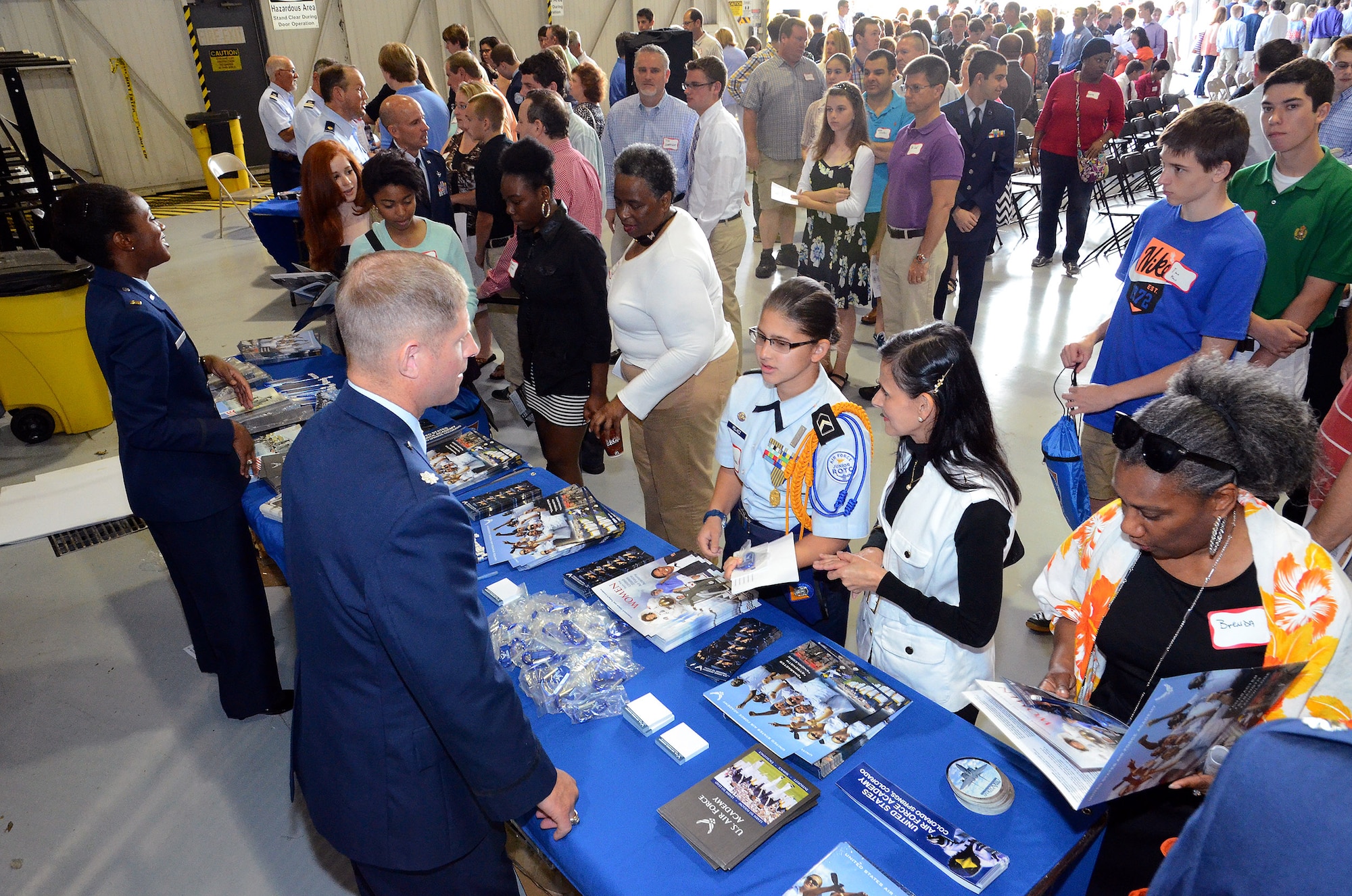 Representatives from the United States Air Force Academy discuss enrollment opportunities with 2015 Academy Day attendees at Dobbins Air Reserve Base, Ga., May 9, 2015. The annual event provides high school students the opportunity to meet with representatives from each of the service academies, including West Point, the U.S. Naval Academy, the U.S. Air Force Academy, the Coast Guard Academy, and the U.S. Merchant Marines Academy. (U.S. Air Force photo/ Brad Fallin)