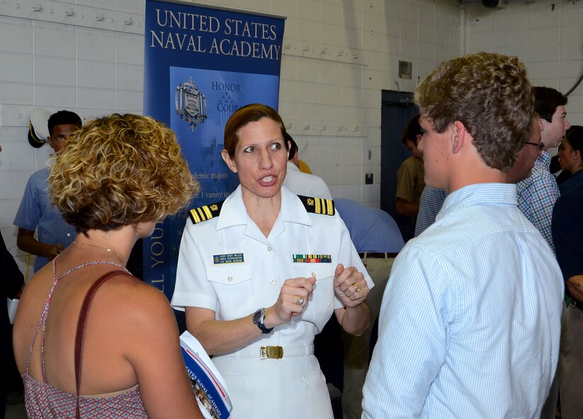 Lt. Cmdr. Cindy Miller, a U.S. Naval Academy representative, speaks to students and family members about the academy application experience during the 2015 Georgia Congressional Delegation Academy Day held at Dobbins Air Reserve Base, Ga., May 9, 2015.The annual event provides high school students the opportunity to meet with representatives from each of the service academies, including West Point, the U.S. Naval Academy, the U.S. Air Force Academy, the Coast Guard Academy, and the U.S. Merchant Marines Academy.  (U.S. Air Force photo/ Brad Fallin)