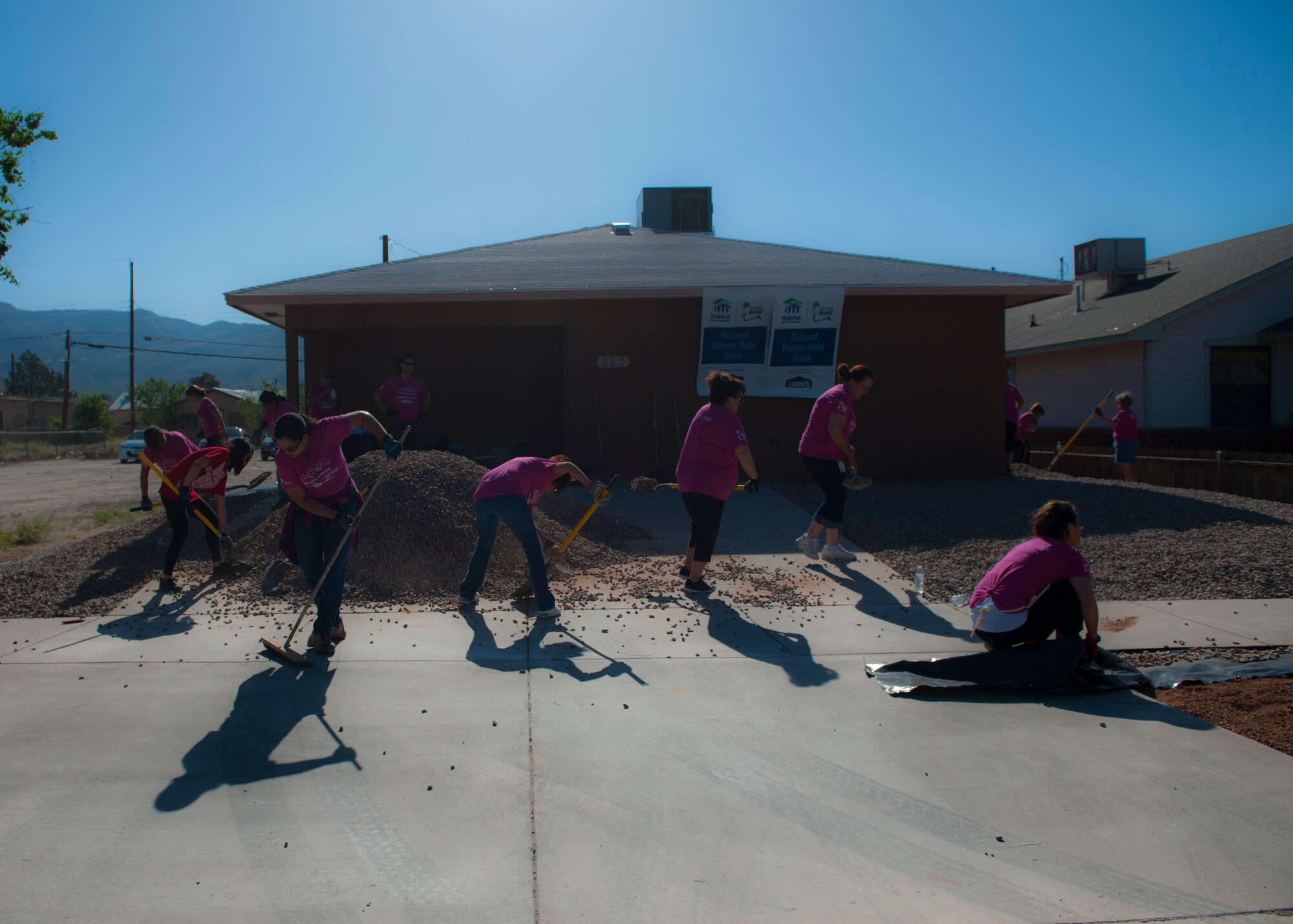 Volunteers for Habitat for Humanity work on landscaping at their construction site in downtown Alamogordo, N.M., May 9, 2015. The volunteers were participating in National Women Build Week, an annual event hosted by Habitat for Humanity where multiple volunteers devote their time to come together to help the members of the community who are less fortunate. (U.S. Air Force photo by Senior Airman Leah Ferrante/released)