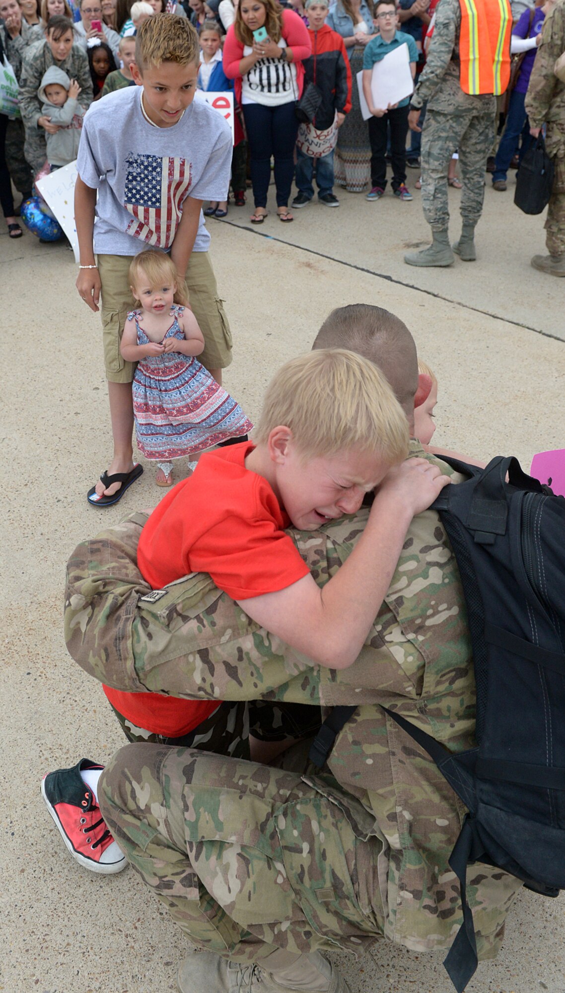 A son greets his father coming home to Hill AFB from a six-month deployment in Afghanistan. Pilots, maintenance, and operations support personnel from the 388th Fighter Wing and 419th Fighter wing were assigned to the 455th Expeditionary Operations Group alongside Airmen from Hill's active-duty 388th Fighter Wing. The deployment is part of Operation Freedom's Sentinel, which aims to maintain security and stability in the area following Operation Enduring Freedom, which officially concluded in 2014.(U.S. Air Force/Alex R. Lloyd)