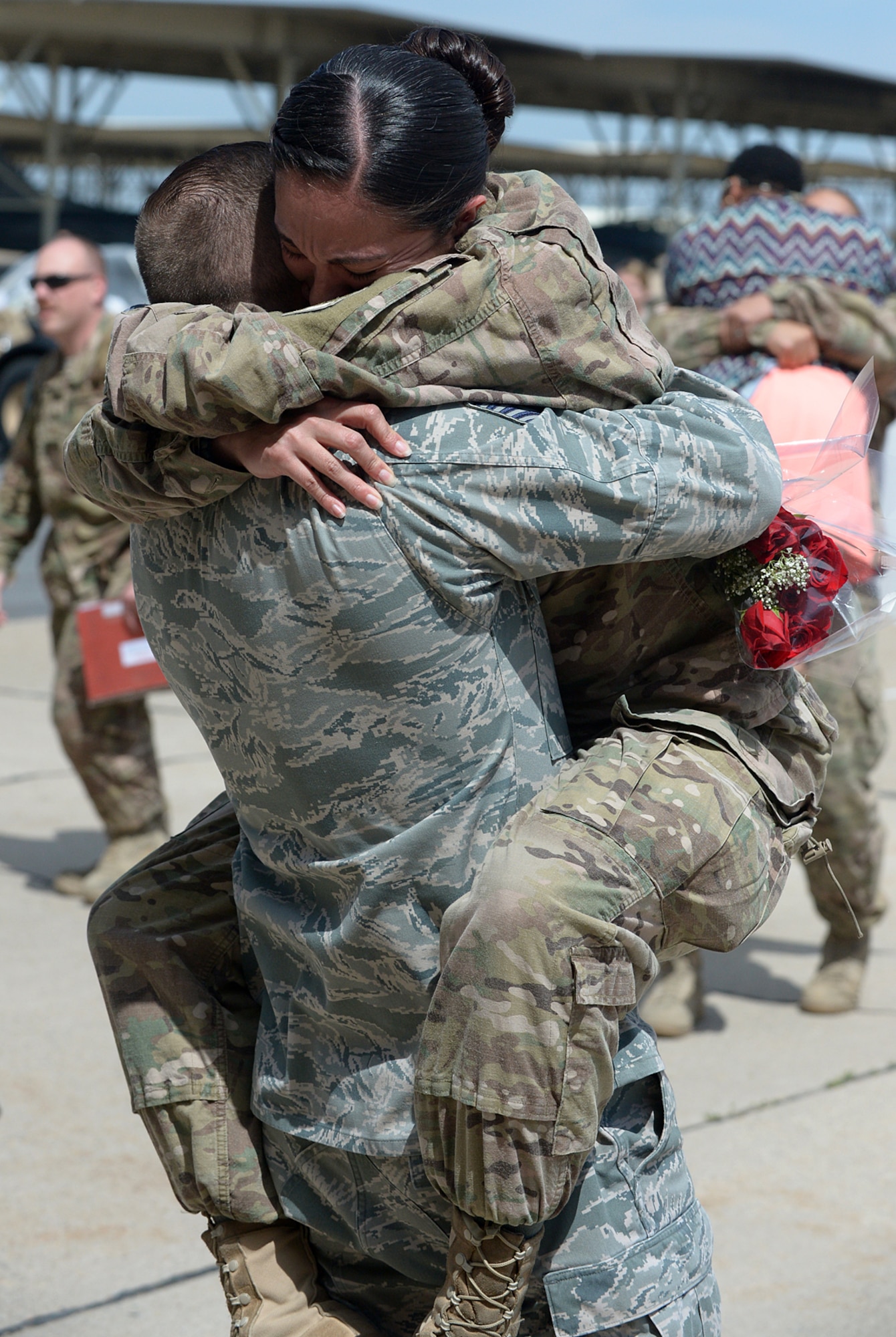 A spouse greets his Airman coming home to Hill AFB from a six-month deployment in Afghanistan. Pilots, maintenance, and operations support personnel from the 388th Fighter Wing and 419th Fighter wing were assigned to the 455th Expeditionary Operations Group alongside Airmen from Hill's active-duty 388th Fighter Wing. The deployment is part of Operation Freedom's Sentinel, which aims to maintain security and stability in the area following Operation Enduring Freedom, which officially concluded in 2014.(U.S. Air Force/Alex R. Lloyd)
