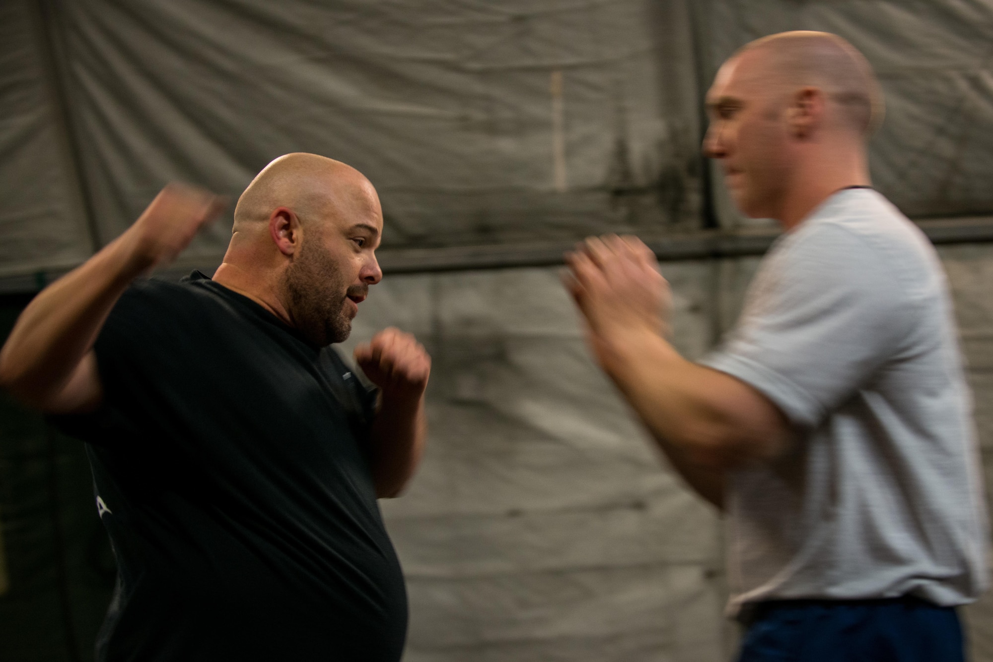 Jack Waid, 455th Air Expeditionary Wing historian, demonstrates a Krav Maga technique during a bi-weekly class at Bagram Airfield, Afghanistan, May 7, 2015.  The training helps Airmen better understand how to defend themselves where they live and work while in a combat environment. (U.S. Air Force photo by Tech. Sgt. Joseph Swafford/Released) 