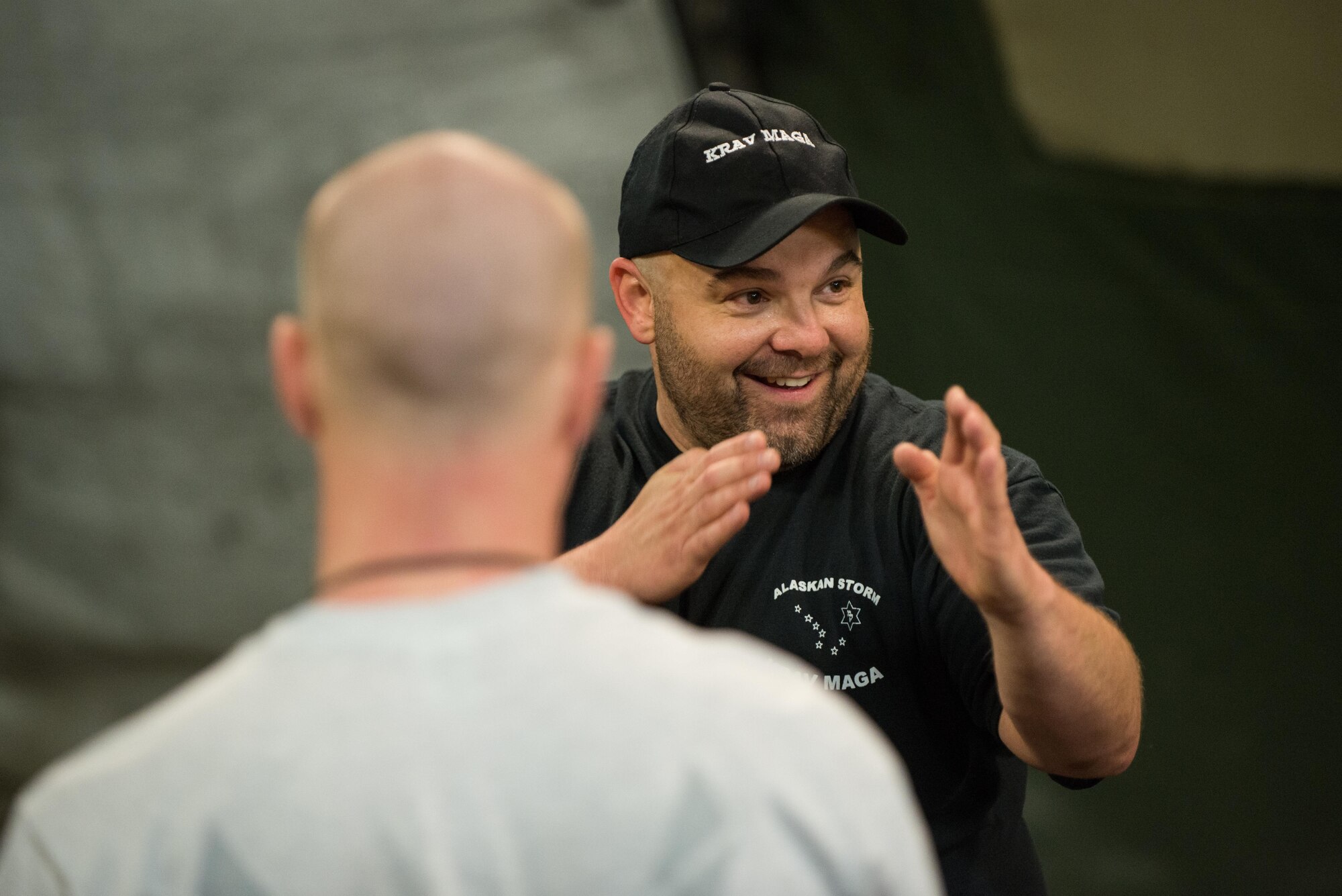 Jack Waid, 455th Air Expeditionary Wing historian, demonstrates a Krav Maga technique during a bi-weekly class at Bagram Airfield, Afghanistan, May 7, 2015.  The training helps Airmen better understand how to defend themselves where they live and work while in a combat environment. (U.S. Air Force photo by Tech. Sgt. Joseph Swafford/Released)