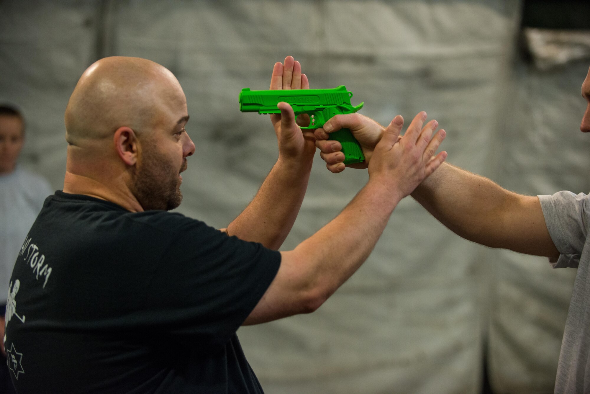Jack Waid, 455th Air Expeditionary Wing historian, demonstrates a Krav Maga technique during a bi-weekly class at Bagram Airfield, Afghanistan, May 7, 2015. The training helps Airmen better understand how to defend themselves where they live and work while in a combat environment. (U.S. Air Force photo by Tech. Sgt. Joseph Swafford/Released)
