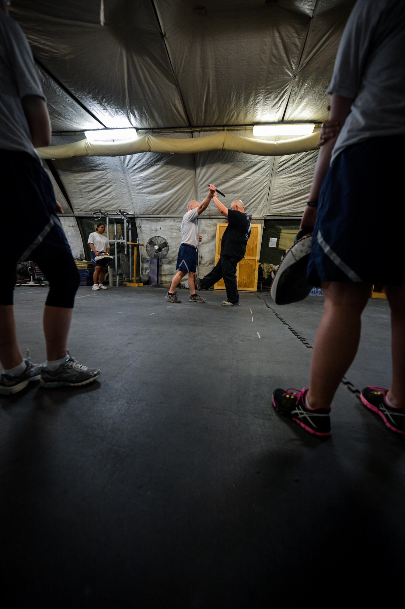Jack Waid, 455th Air Expeditionary Wing historian, demonstrates a Krav Maga technique during a bi-weekly class at Bagram Airfield, Afghanistan, May 7, 2015. The training helps Airmen better understand how to defend themselves where they live and work while in a combat environment. (U.S. Air Force photo by Tech. Sgt. Joseph Swafford/Released)