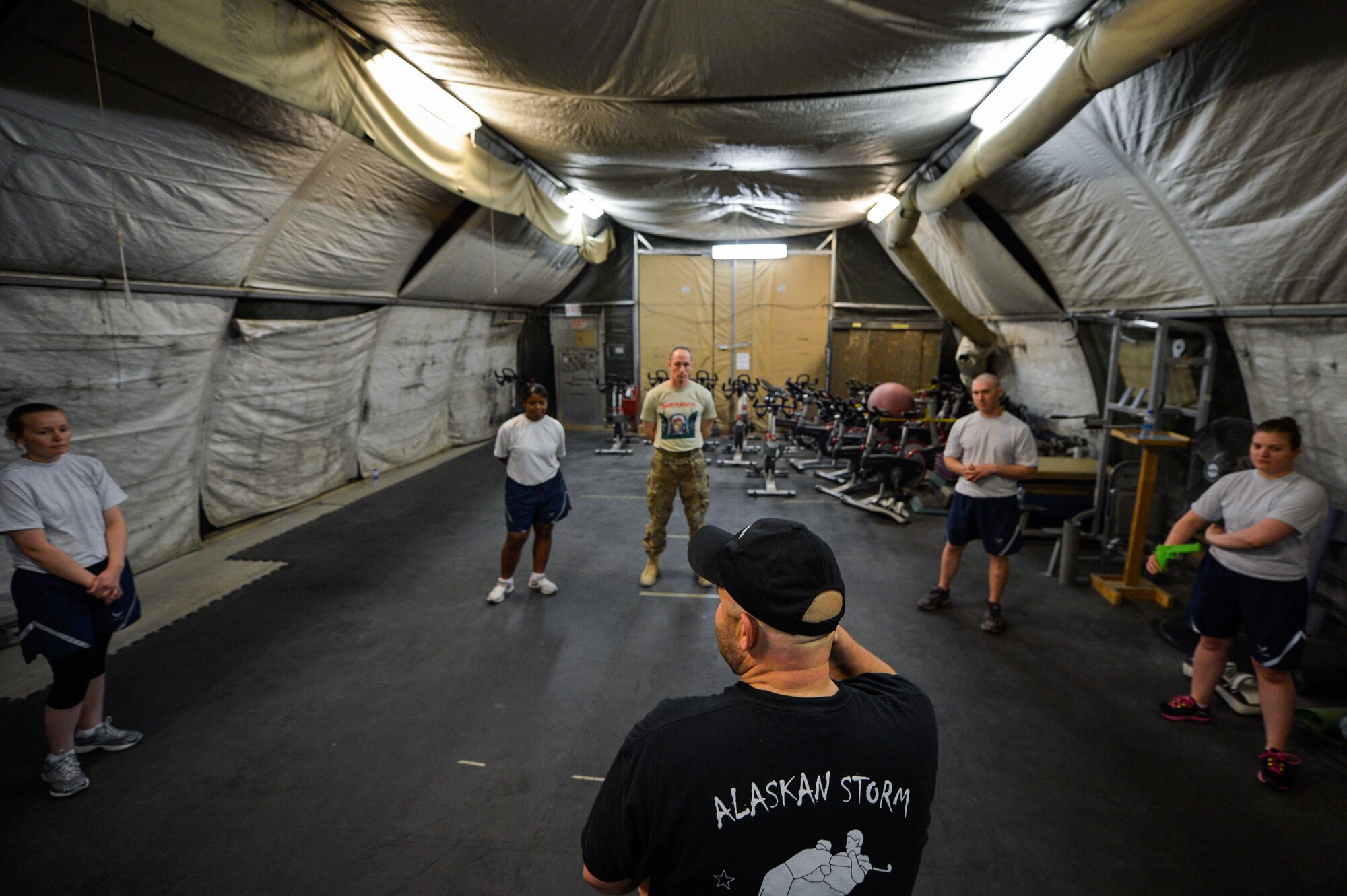 Jack Waid, 455th Air Expeditionary Wing historian, talks with Krav Maga students during a bi-weekly class at Bagram Airfield, Afghanistan, May 7, 2015.  The training helps Airmen better understand how to defend themselves where they live and work while in a combat environment. (U.S. Air Force photo by Tech. Sgt. Joseph Swafford/Released)