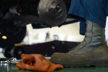 Senior Airman Brandon Higginbotham, 374th Logistics Readiness Squadron vehicle maintenance journeyman, performs maintenance on a government vehicle at Yokota Air Base, Japan, April 28, 2015. Higginbotham repairs and maintains approximately 89 vehicles per month. (U.S. Air Force photo by Airman 1st Class David C. Danford/Released)
