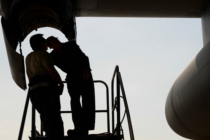 Staff Sgt. Senh Vong, left, and Senior Airman Jaren Rykse, sheet metal and aircraft structural maintainers with the 374th Maintenance Squadron, perform repairs on the engine of a C-130 Hercules, April 29, 2015 at Yokota Air Base, Japan. All four engines of the aircraft underwent repairs after a routine annual inspection. (U.S. Air Force photo by Airman 1st Class Elizabeth Baker/Released)