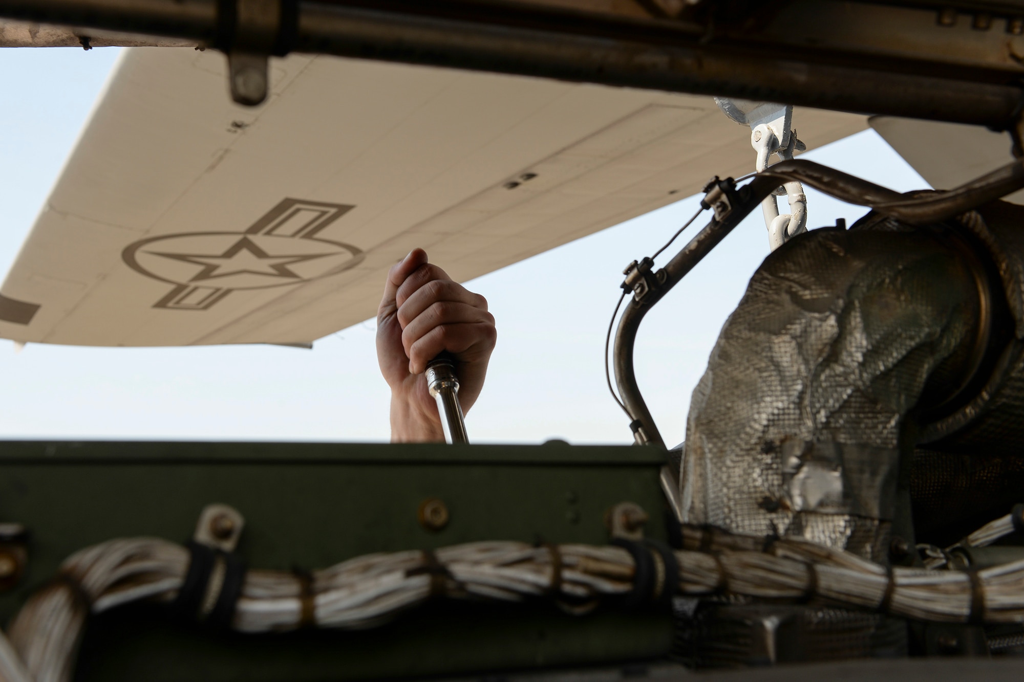 An Airman with the 374th Maintenance Squadron performs repairs on the engine of a C-130 Hercules, April 29, 2015 at Yokota Air Base, Japan. The 374 MXS and the 374th Aircraft Maintenance Squadron conducted a rare operation by removing all four engines from the C-130 H in one day, which none of the maintainers had done before. (U.S. Air Force photo by Airman 1st Class Elizabeth Baker/Released)