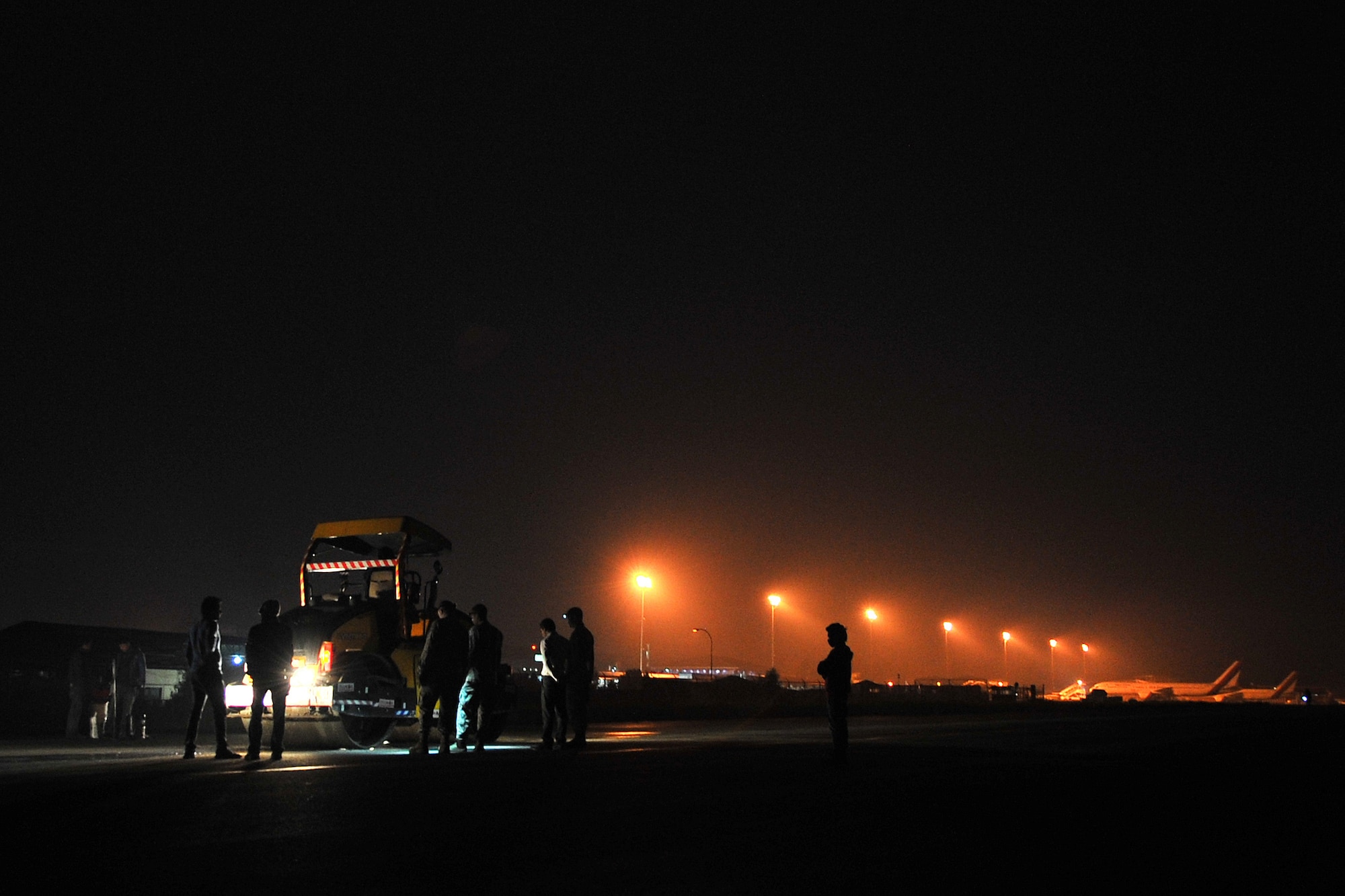 Civil Aviation Authority of Nepal members along with U.S. Air Force 36th Contingency Response Group Airmen attached to Joint Task Force-505 work together to repair the runway at the Tribhuvan International Airport in Kathmandu, Nepal, May 10, 2015. The Nepalese officials and Airmen teamed up to conduct necessary repairs to the airfield after it sustained damage following a magnitude 7.8 earthquake that struck the nation April 25, 2015. In response to the Nepal earthquake, the U.S. military sent Airmen, Marines, Soldiers and Sailors as part of JTF-505 to support the humanitarian assistance and disaster relief mission in Nepal at the direction of U.S. Agency for International Development. (U.S. Air Force photo by Staff Sgt. Melissa B. White/Released)