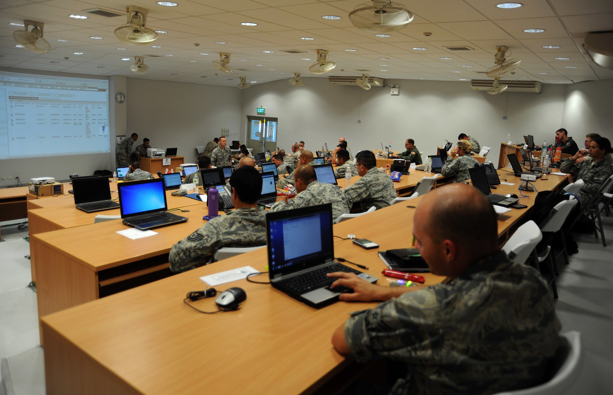 Joint Task Force-505 personnel assist and monitor humanitarian assistance and disaster relief operations at the JTF-505 Joint Operations Center at Utapao Royal Thai Navy Airfield, Thailand, May 10, 2015. The joint operations center established in Utapao serves as a staging point for JTF-505 aviation assets and key planners conducting humanitarian aid and disaster relief operations in support of the 7.8 magnitude earthquake that struck Nepal, April 25, 2015. (U.S. Air Force photo by Staff Sgt. Alexander Martinez/Released)