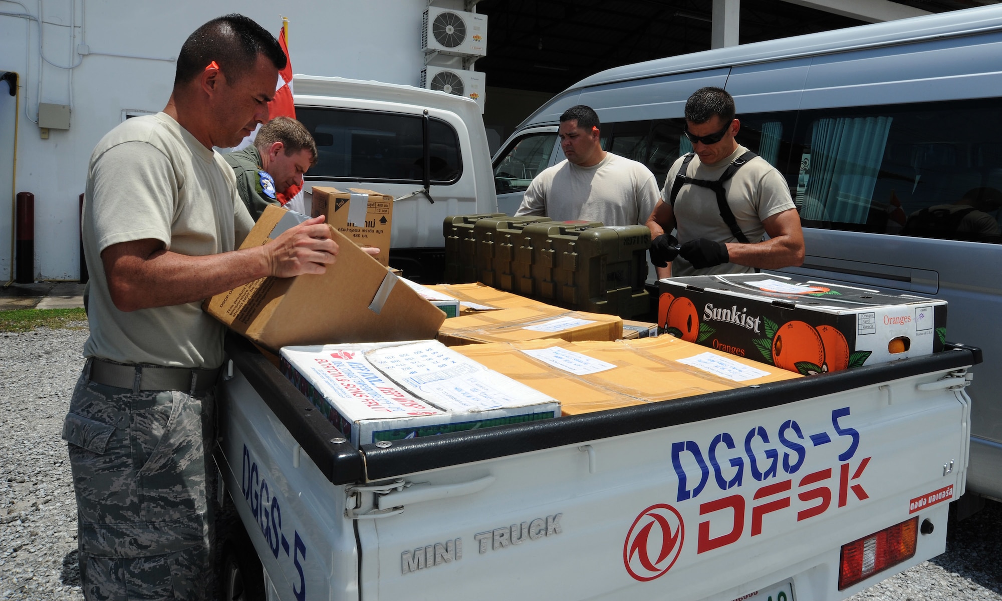 Joint Task Force-505 Airmen load the back of a truck with relief supplies bound for Kathmandu, Nepal in Utapao Royal Thai Navy Airfield, Thailand, May 10, 2015. The joint operations center established in Utapao serves as a staging point for JTF-505 aviation assets and key planners conducting humanitarian aid and disaster relief operations in response to the 7.8 magnitude earthquake that struck Nepal, April 25, 2015. (U.S. Air Force photo by Staff Sgt. Alexander Martinez/Released)