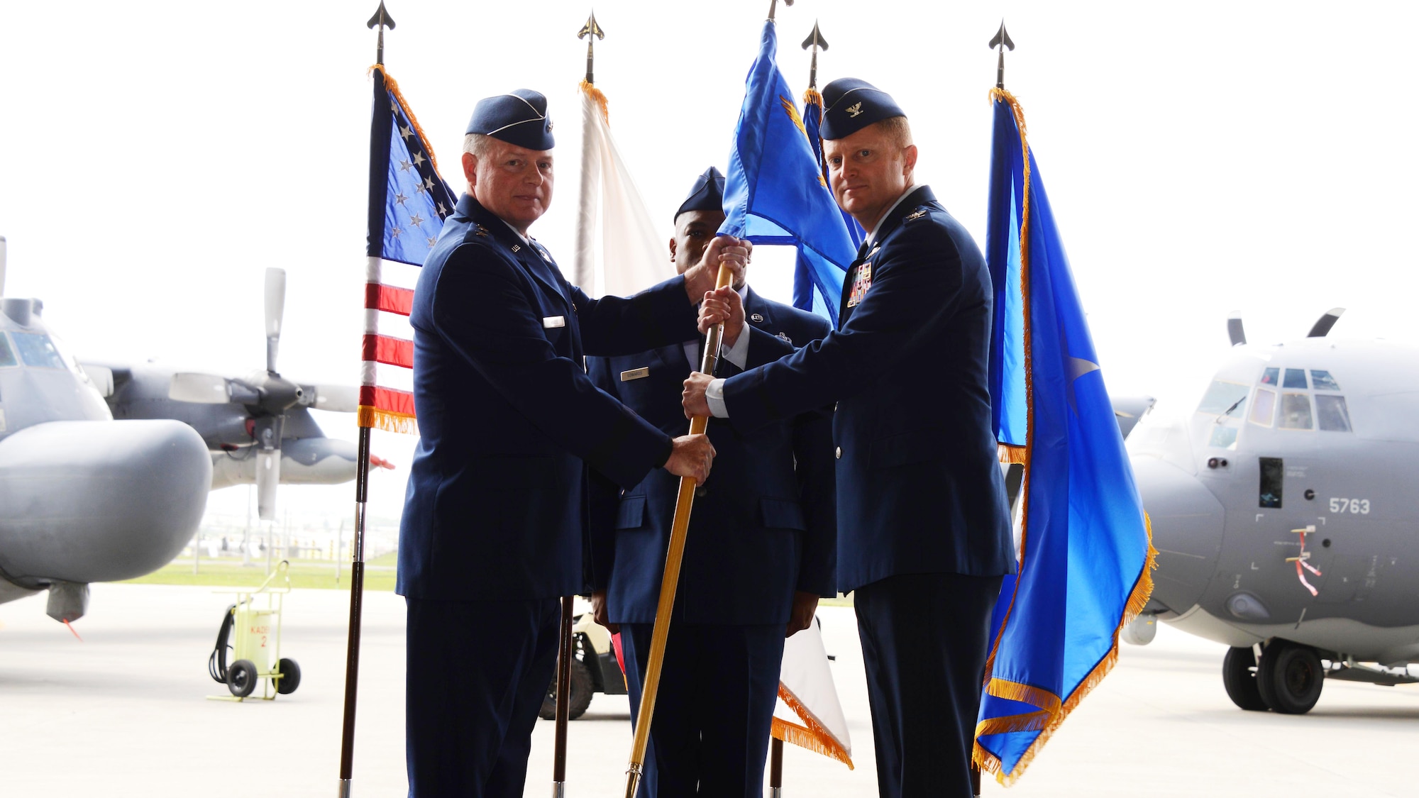 Col.  William C. Freeman accepts the guidon from Maj. Gen. Morris E. Haase, Air Force Special Operations Command vice commander, during an Assumption of Command ceremony held May 8, 2015 on Kadena Air Base, Japan.  The 353rd Special Operations Group is the only Air Force Special Operations unit in the Department of Defense’s largest area of responsibility.  (U.S. Air Force photo by Tech. Sgt. Kristine Dreyer)