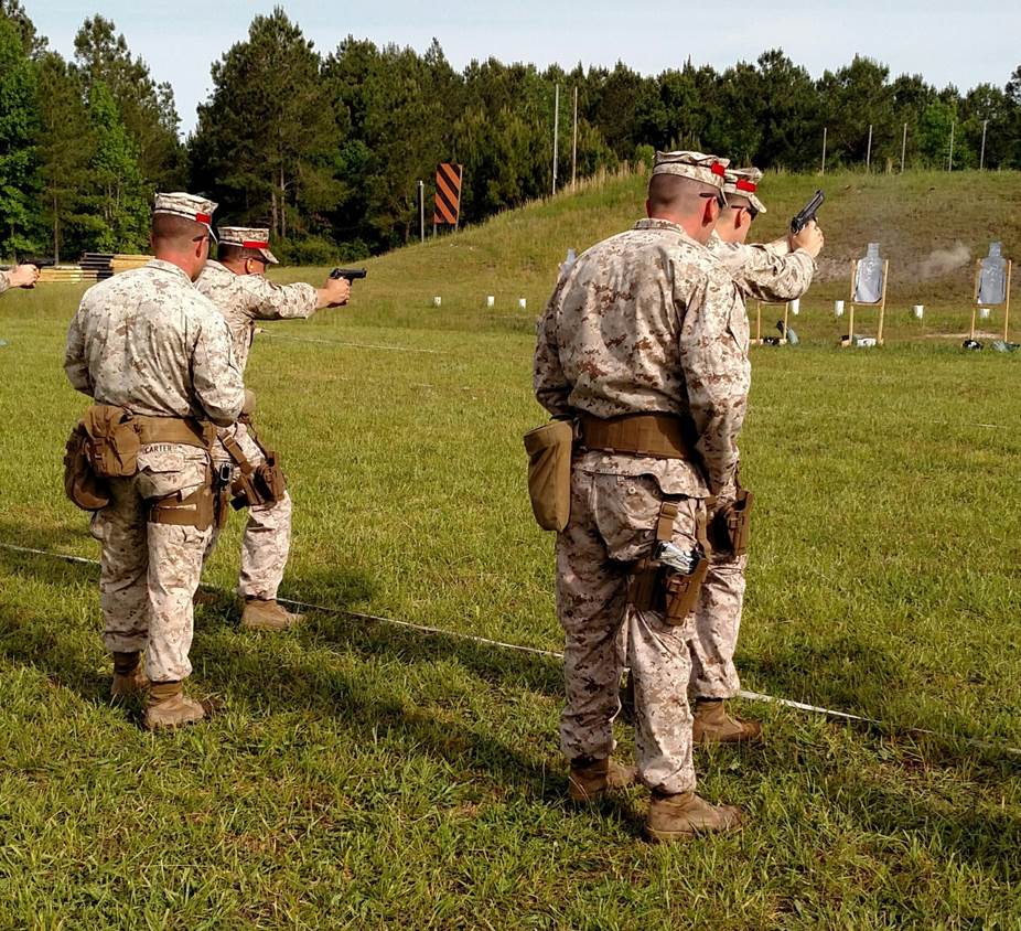 5 May 2015 – Combat Marksmanship Coaches’ Course students conduct Combat Pistol Program training.  During the course, students switch responsibility between shooting and coaching to improve their personal marksmanship and coaching proficiency.
